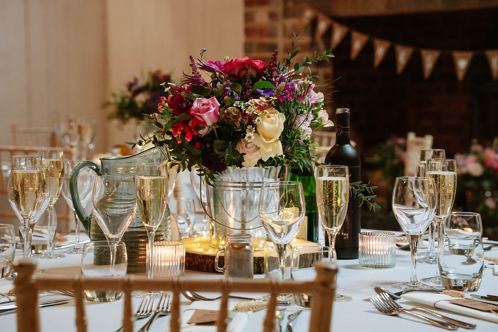 a place setting with flowers and a menu