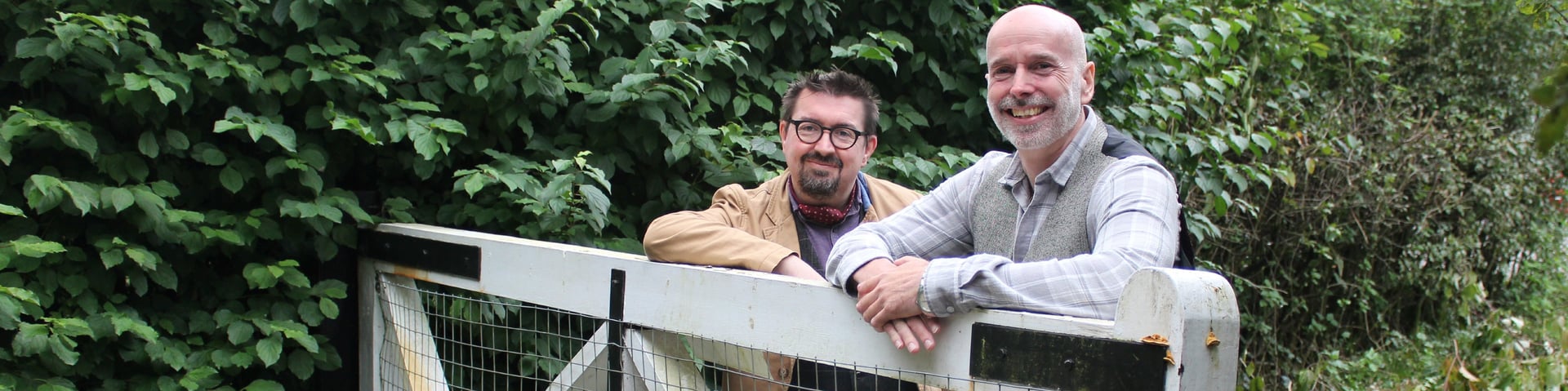 an abstract photo of a curved building with a blue sky in the background