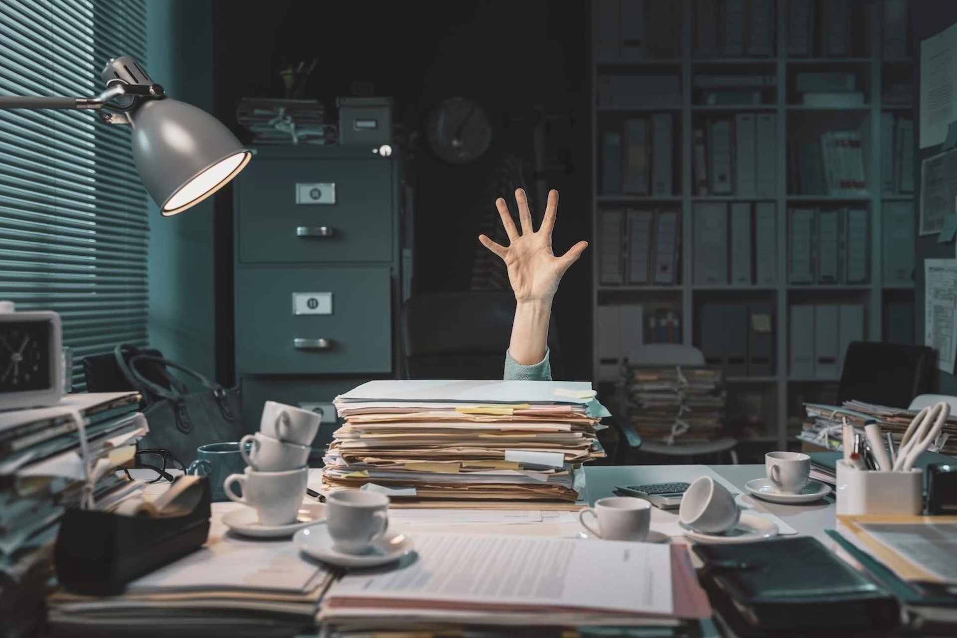Person drowning in paperwork