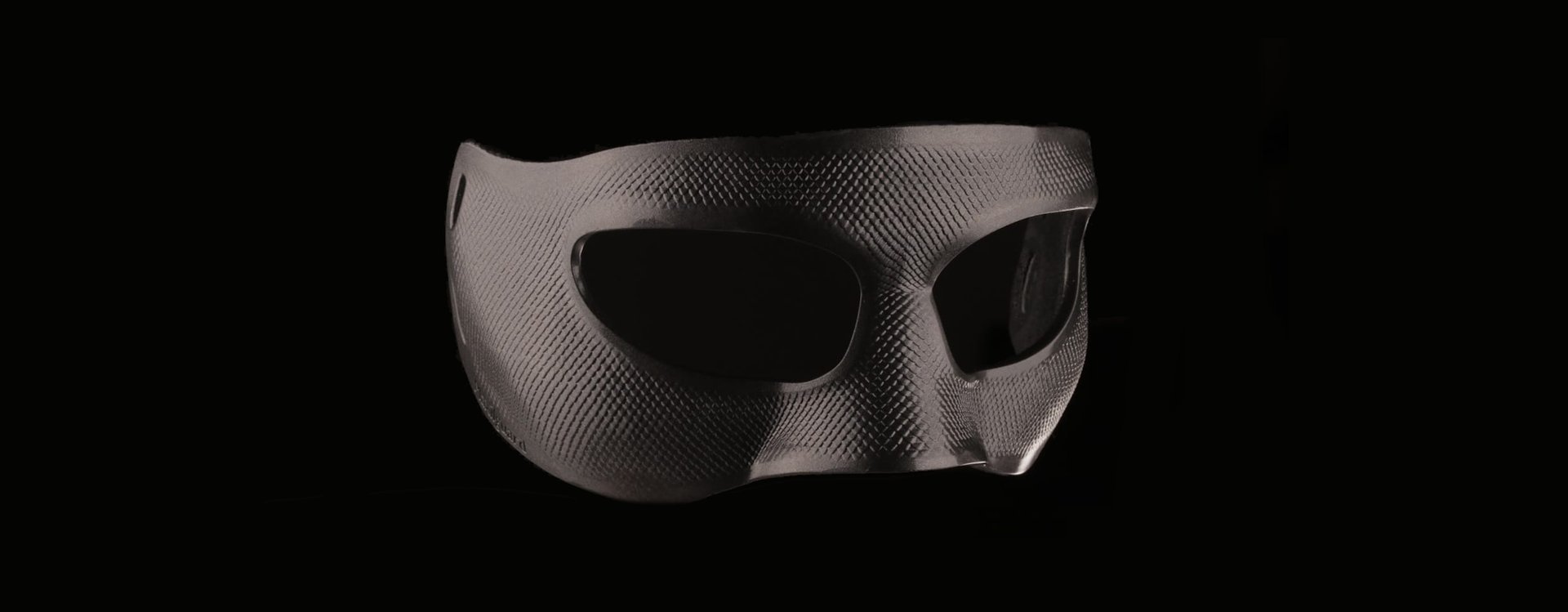 an abstract photo of a curved building with a blue sky in the background