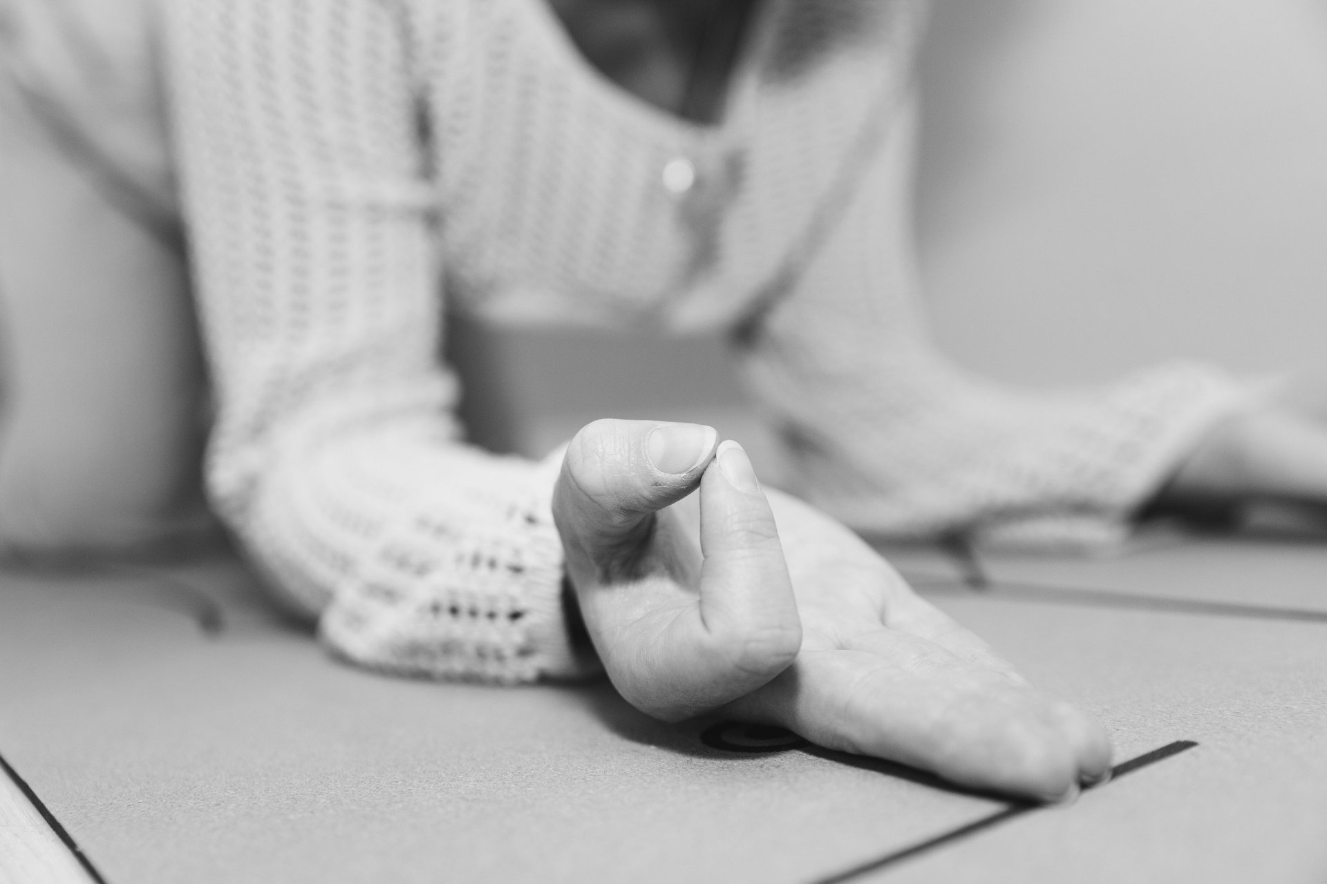 grayscale photo of persons hand