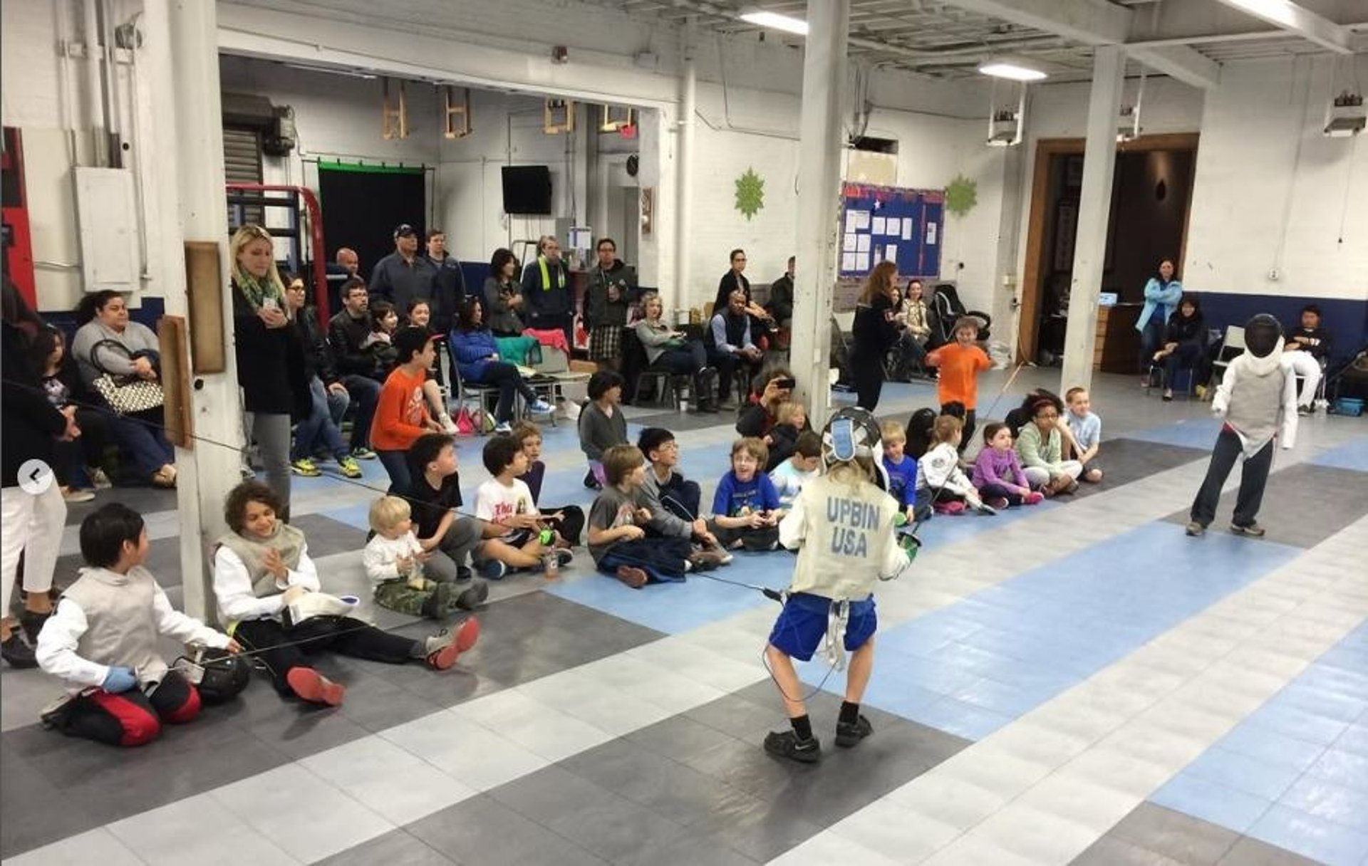 person wearing grey knit sweater