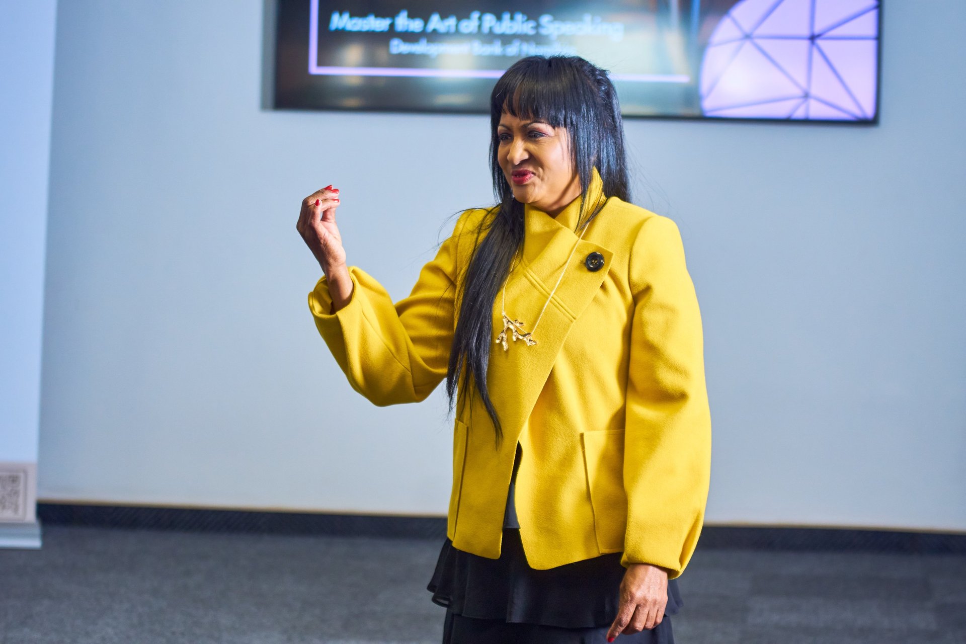Erica Mulondo evaluating a public speech