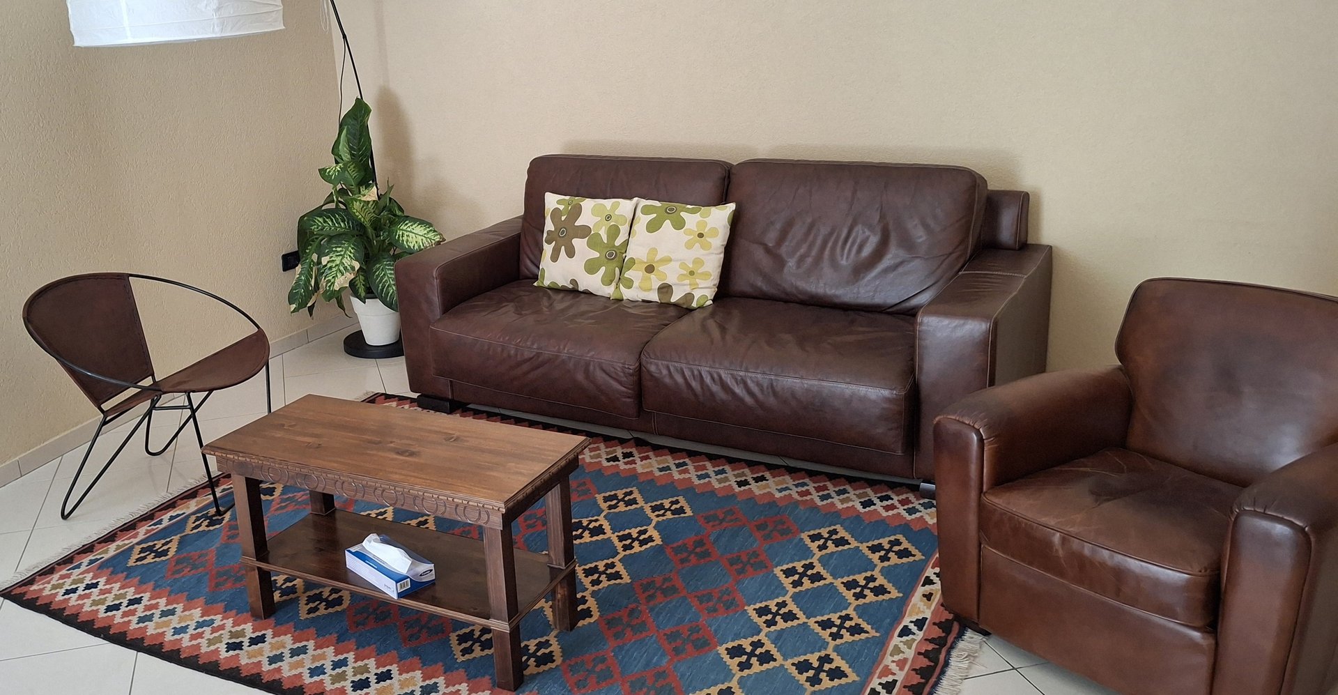 black and brown leather padded tub sofa