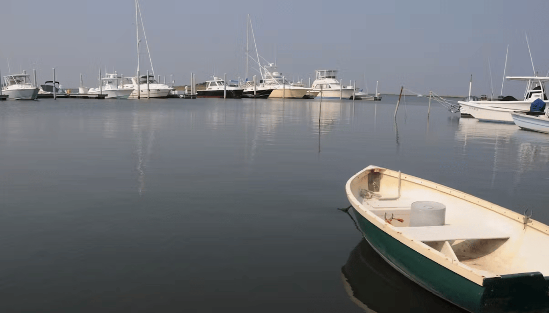 woman wearing yellow long-sleeved dress under white clouds and blue sky during daytime