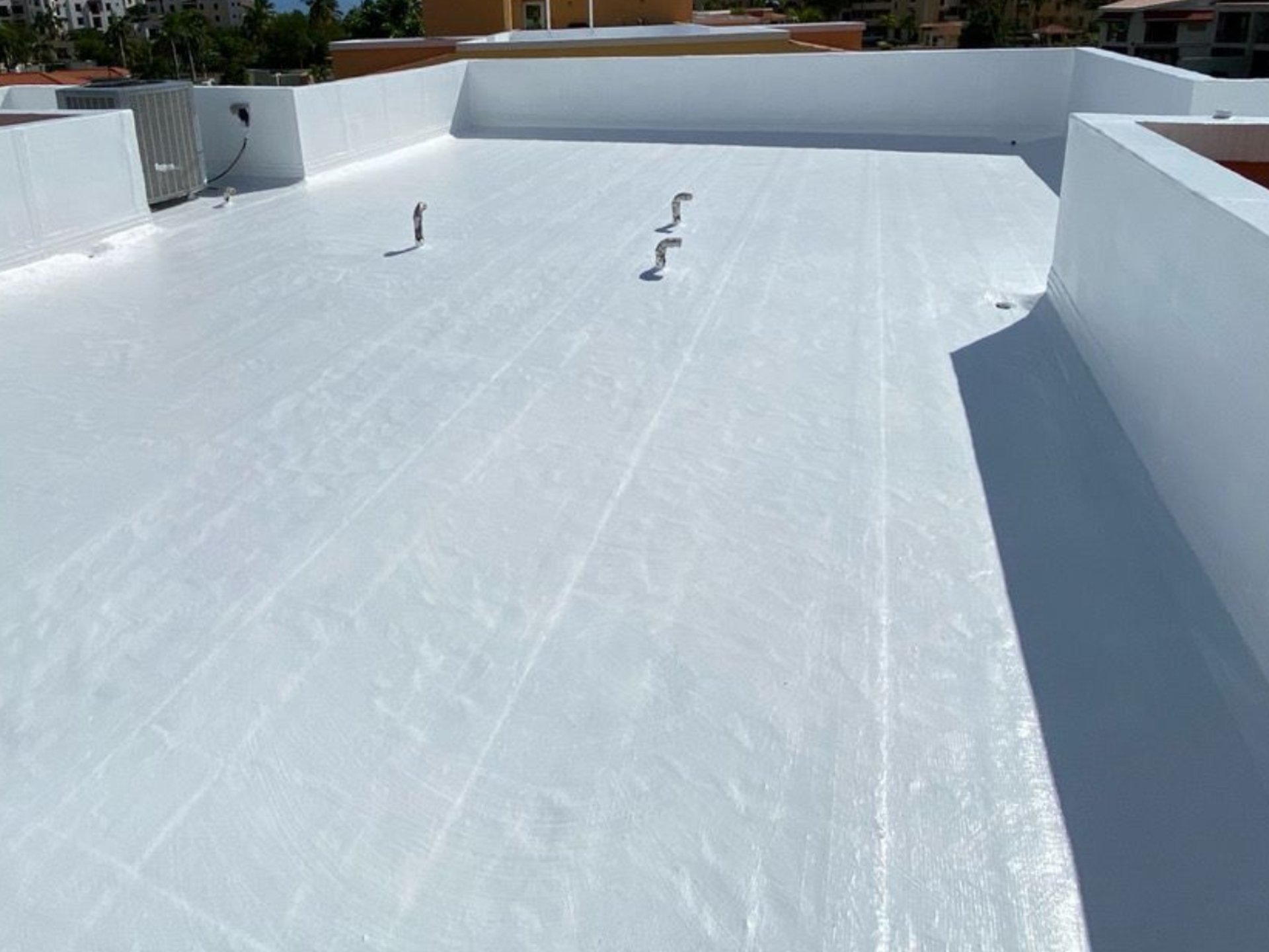 an abstract photo of a curved building with a blue sky in the background