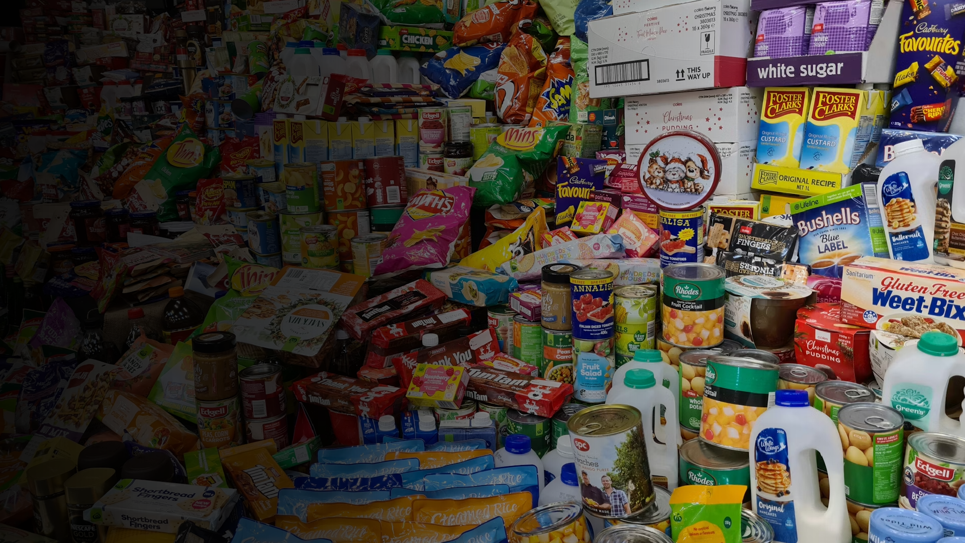 an abstract photo of a curved building with a blue sky in the background