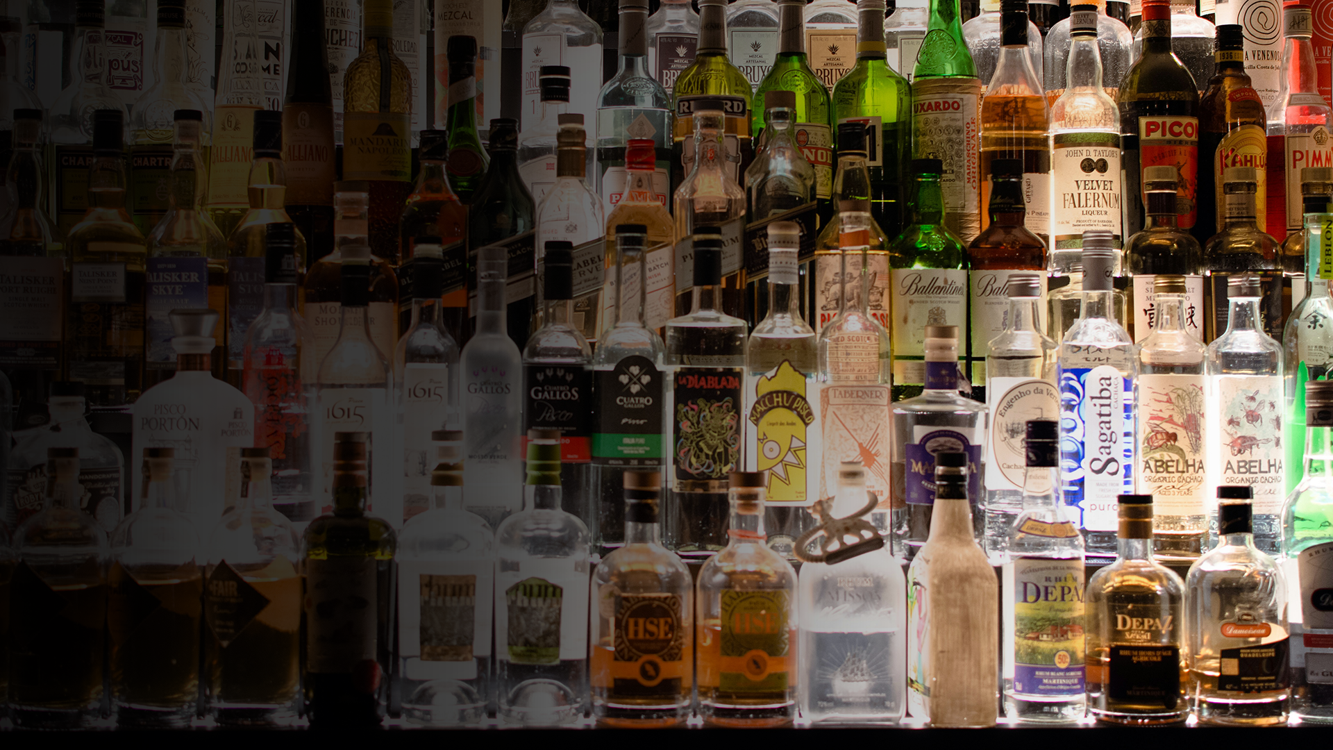 an abstract photo of a curved building with a blue sky in the background