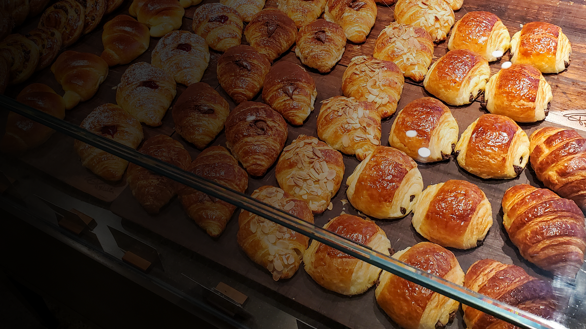 an abstract photo of a curved building with a blue sky in the background