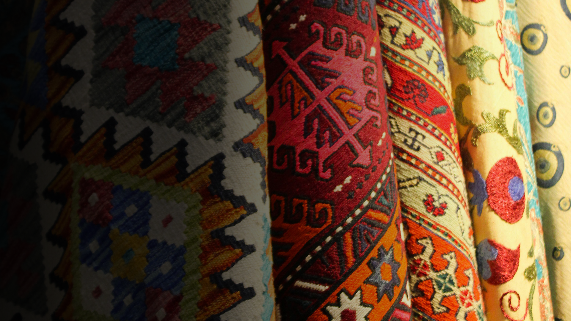 an abstract photo of a curved building with a blue sky in the background