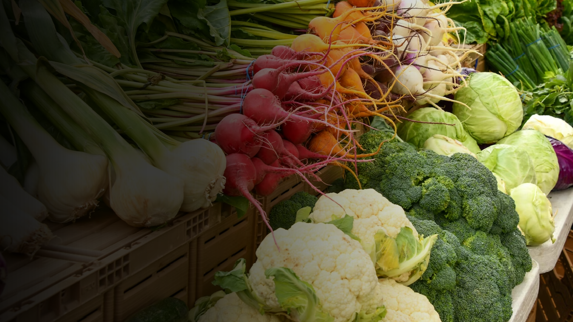 an abstract photo of a curved building with a blue sky in the background