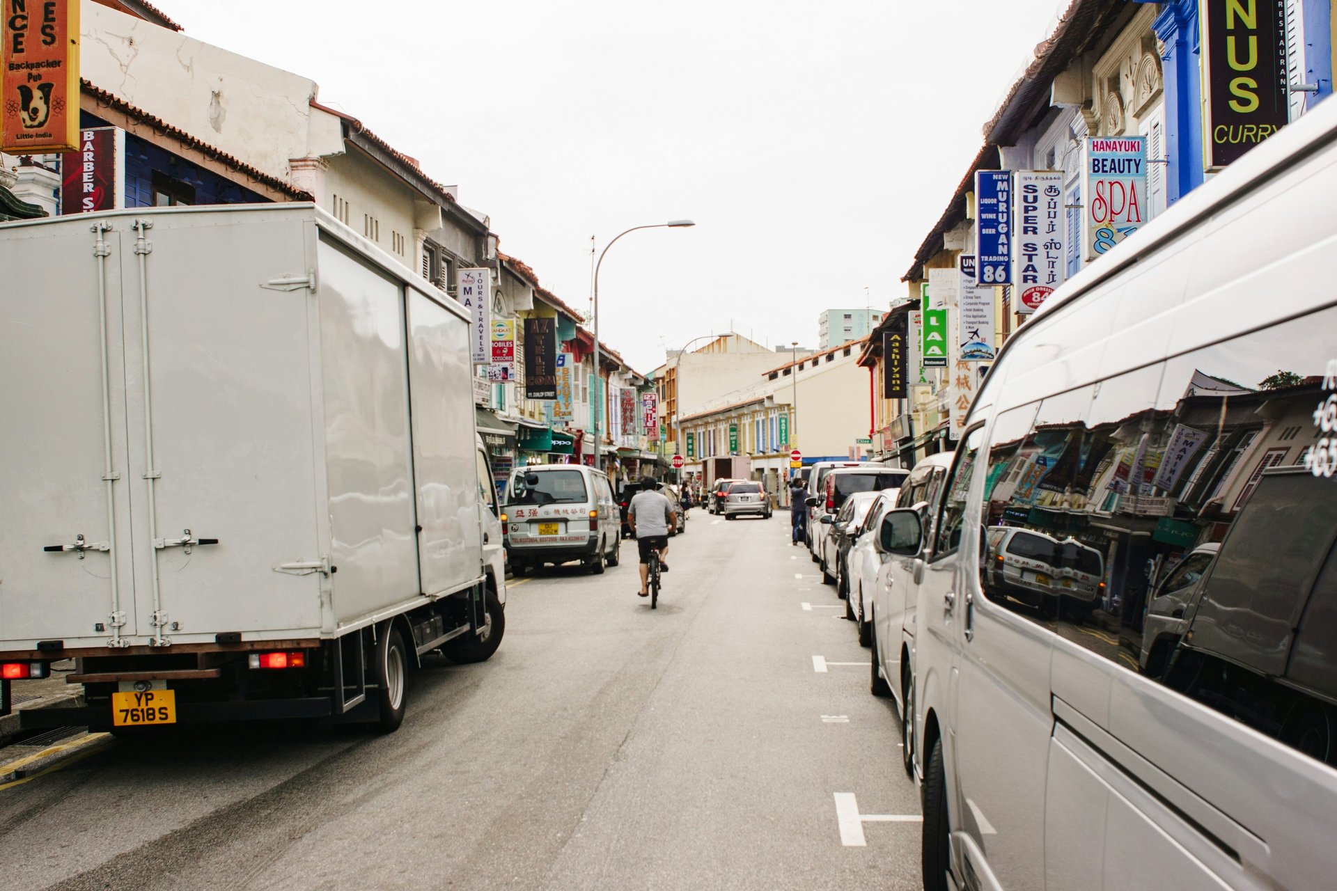 woman wearing yellow long-sleeved dress under white clouds and blue sky during daytime