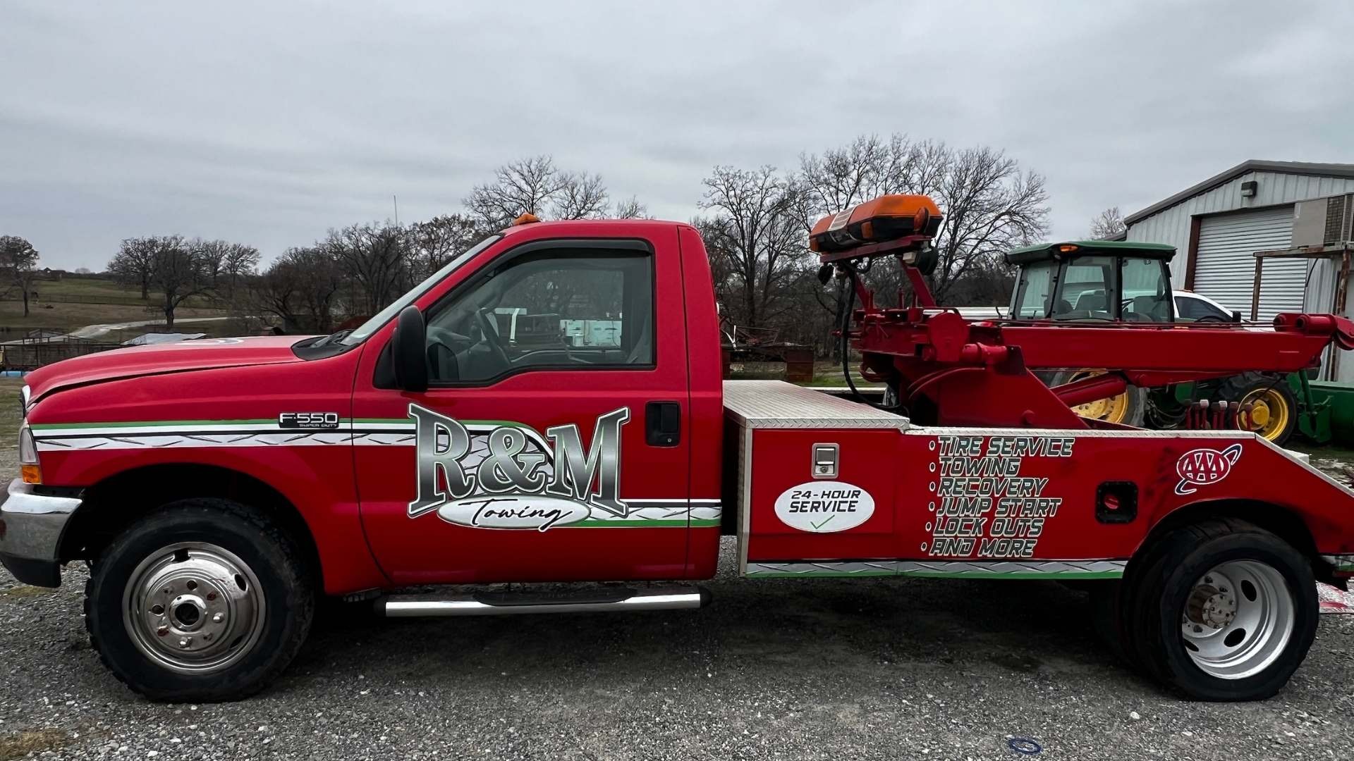 A tow truck towing a car on a flatbed