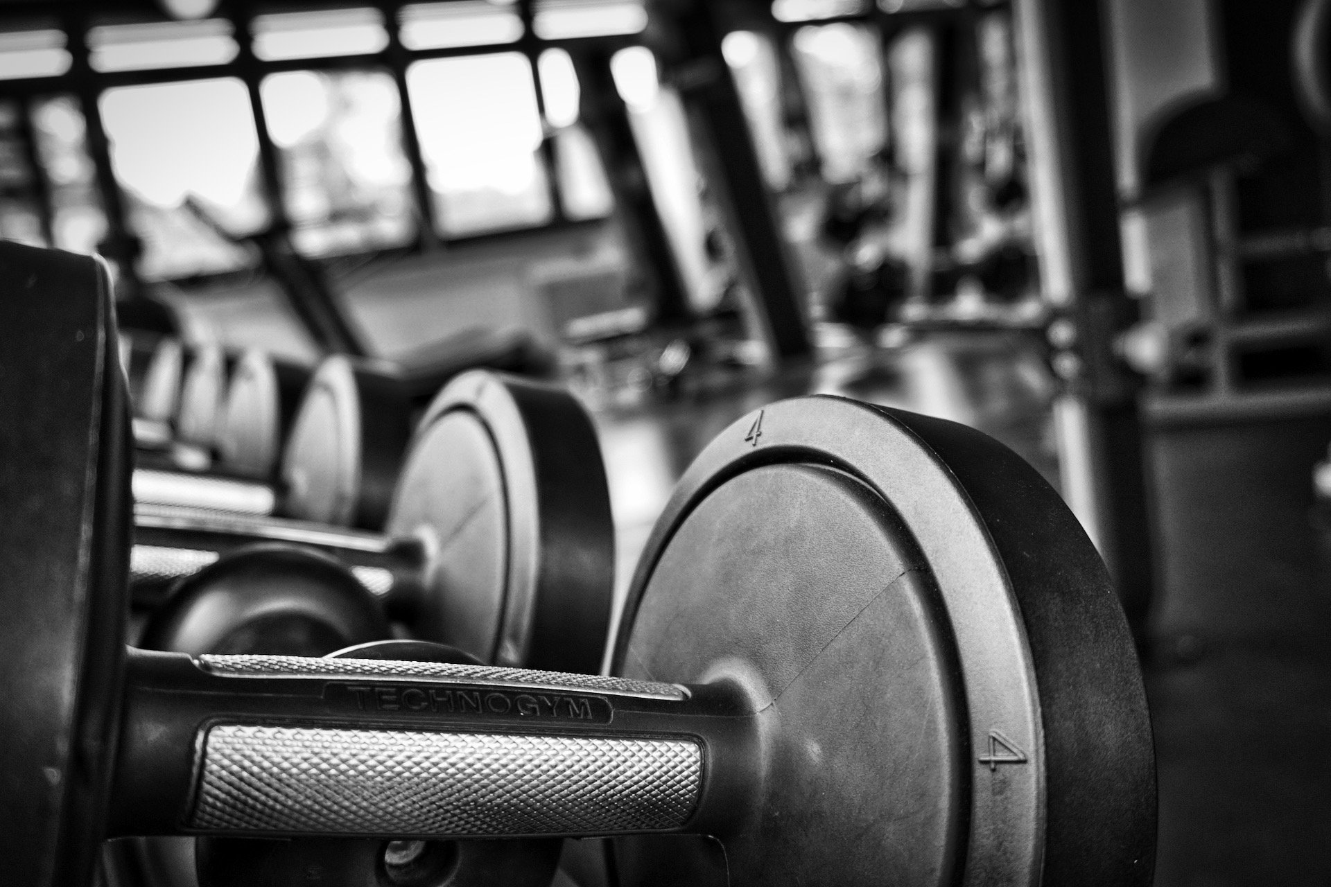 an abstract photo of a curved building with a blue sky in the background