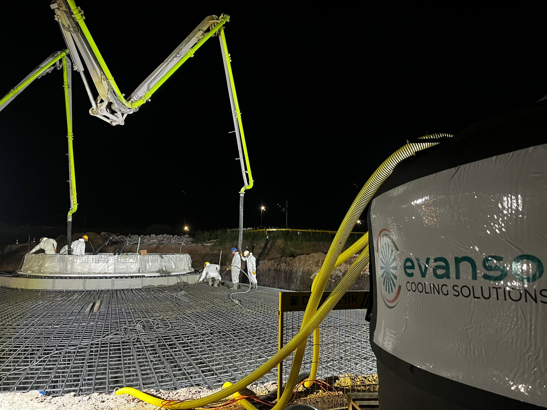 an abstract photo of a curved building with a blue sky in the background