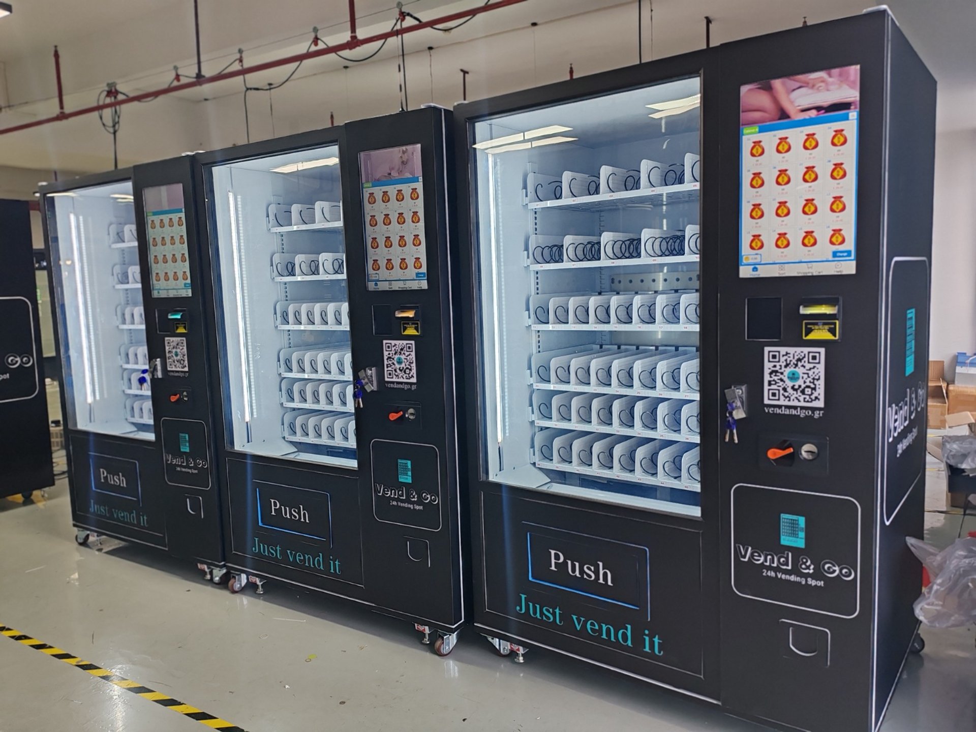 coca cola and coca cola bottles in black vending machine
