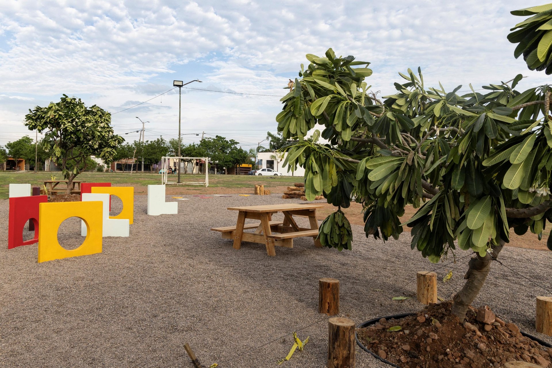 an abstract photo of a curved building with a blue sky in the background