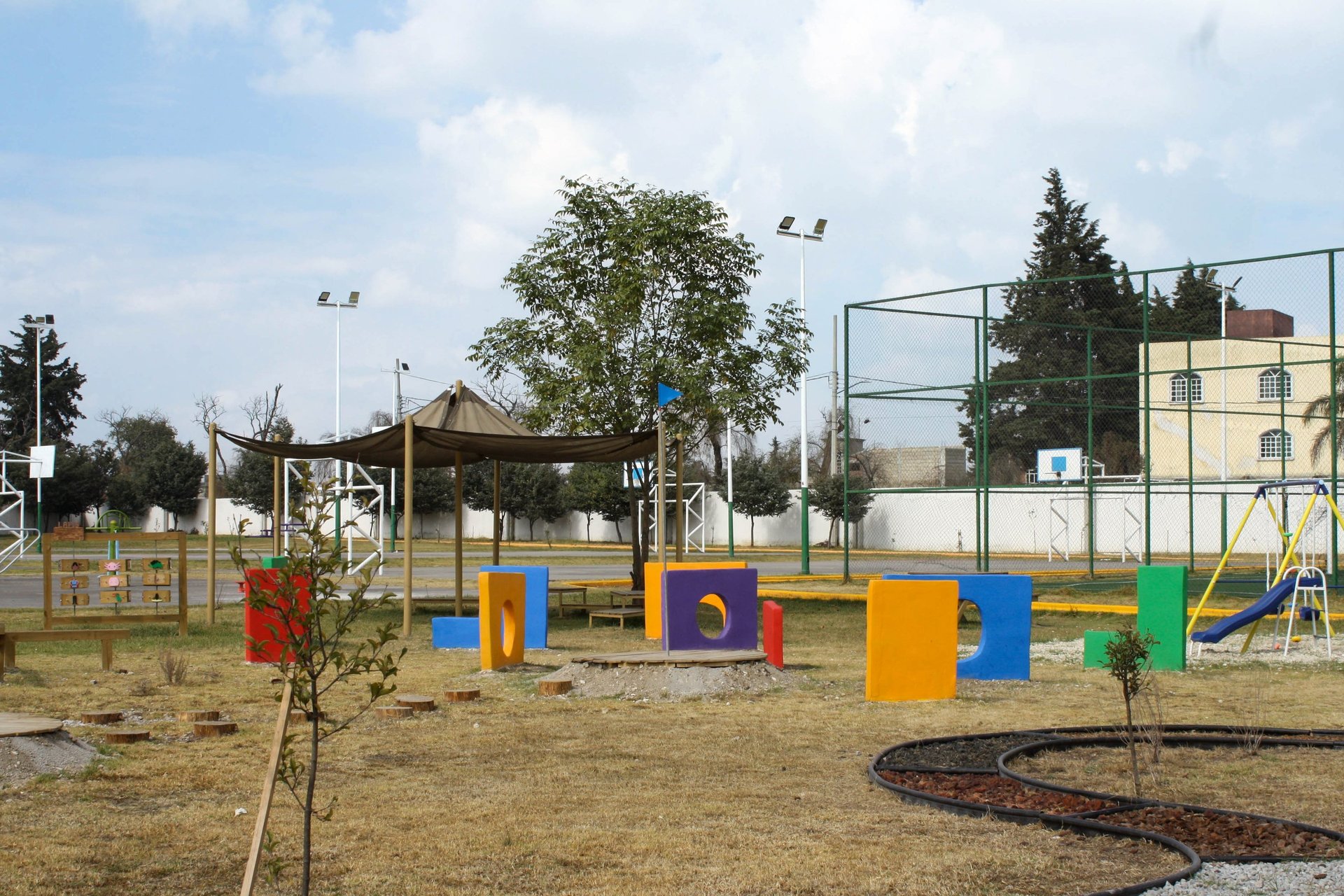 an abstract photo of a curved building with a blue sky in the background