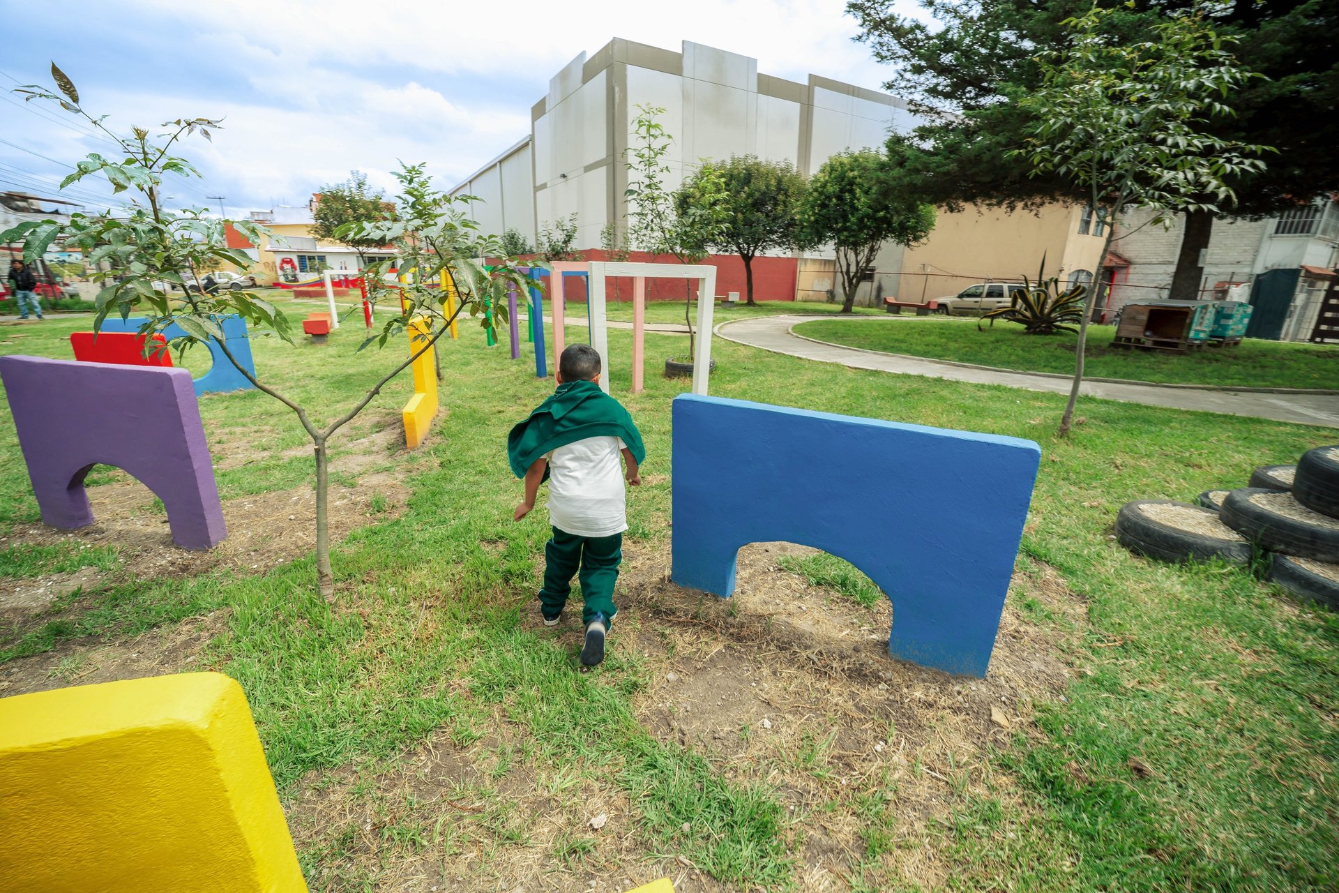 an abstract photo of a curved building with a blue sky in the background
