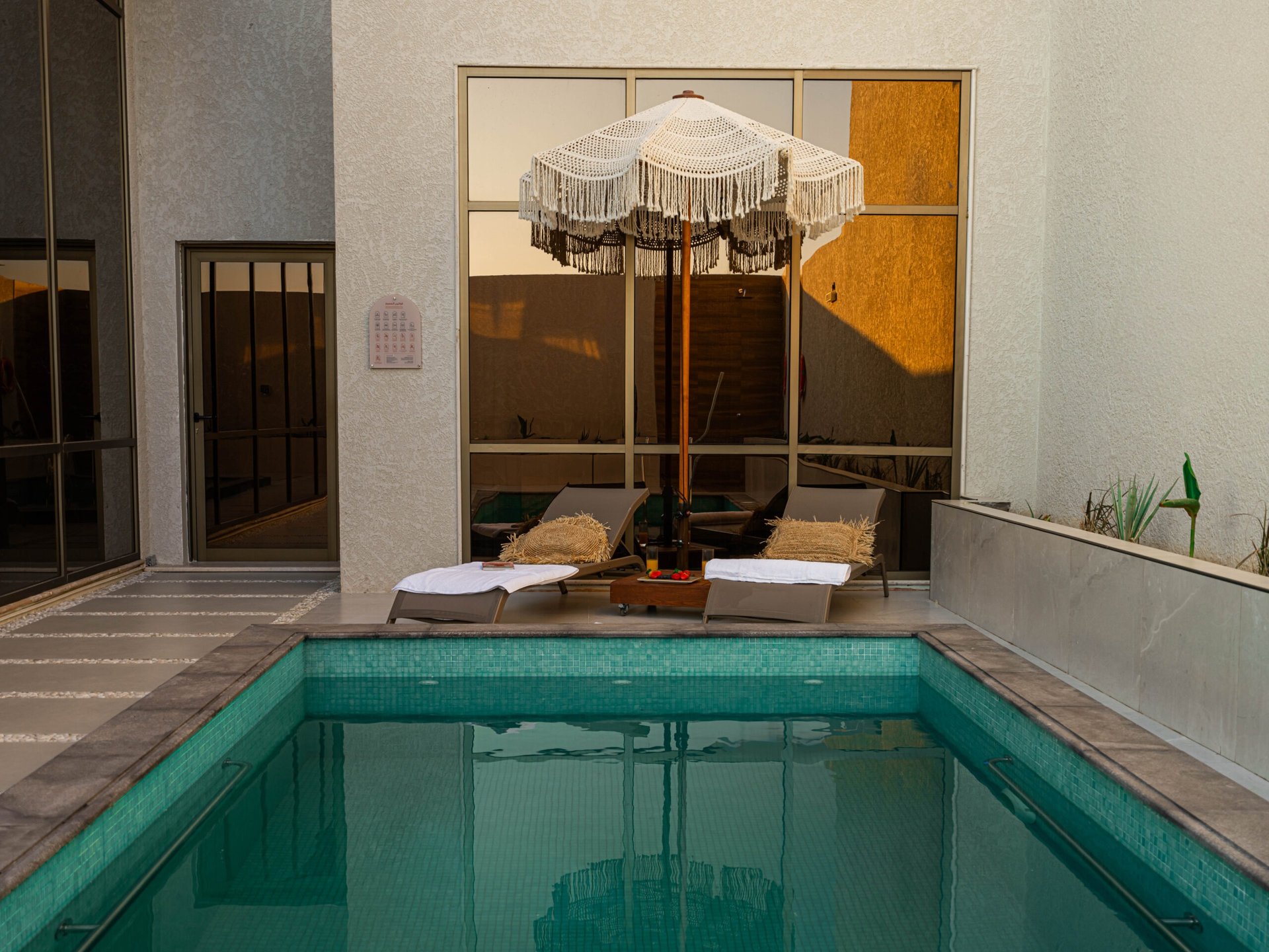 people walking on snow covered field near brown concrete building during daytime