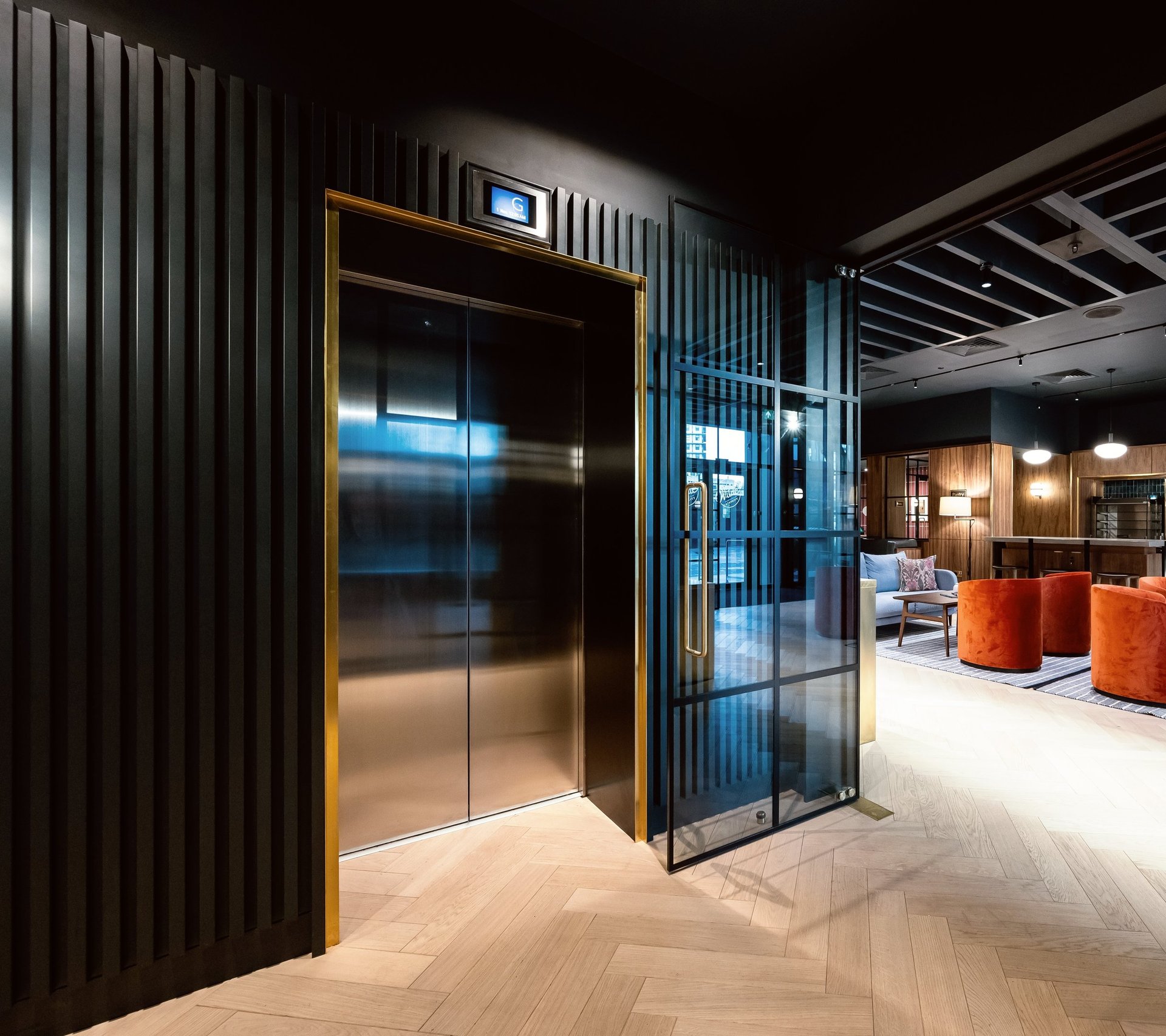 an abstract photo of a curved building with a blue sky in the background