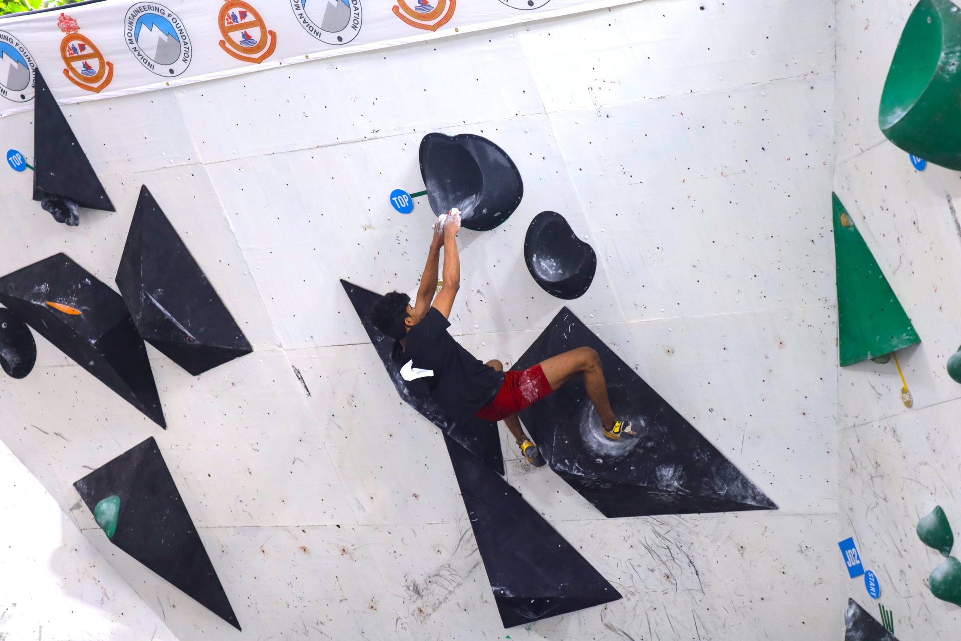 woman on kayak on body of water holding paddle