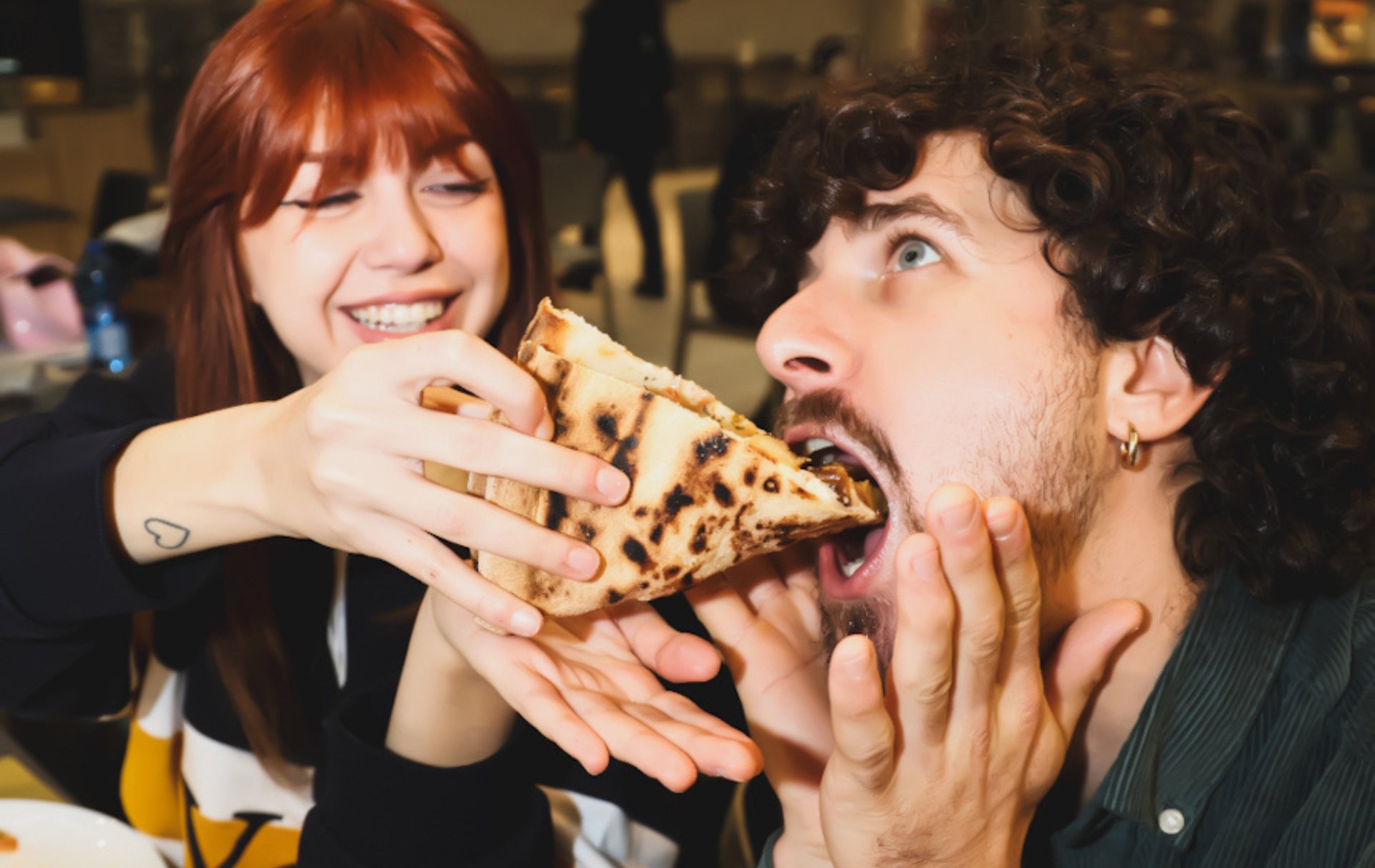 an abstract photo of a curved building with a blue sky in the background