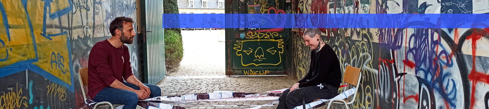 an abstract photo of a curved building with a blue sky in the background