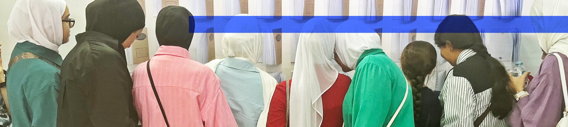 an abstract photo of a curved building with a blue sky in the background