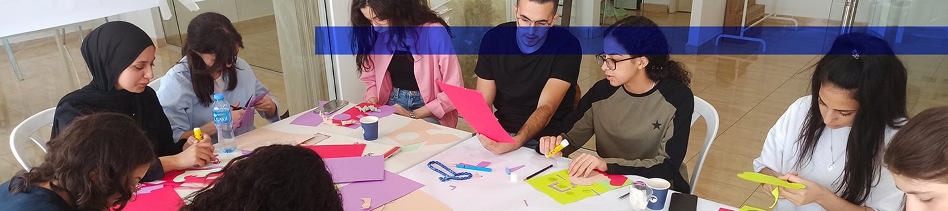 an abstract photo of a curved building with a blue sky in the background
