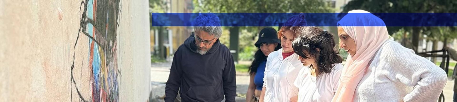 an abstract photo of a curved building with a blue sky in the background