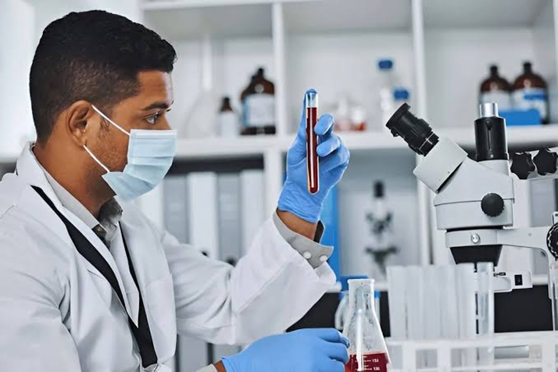 person holding silver and black hand tool