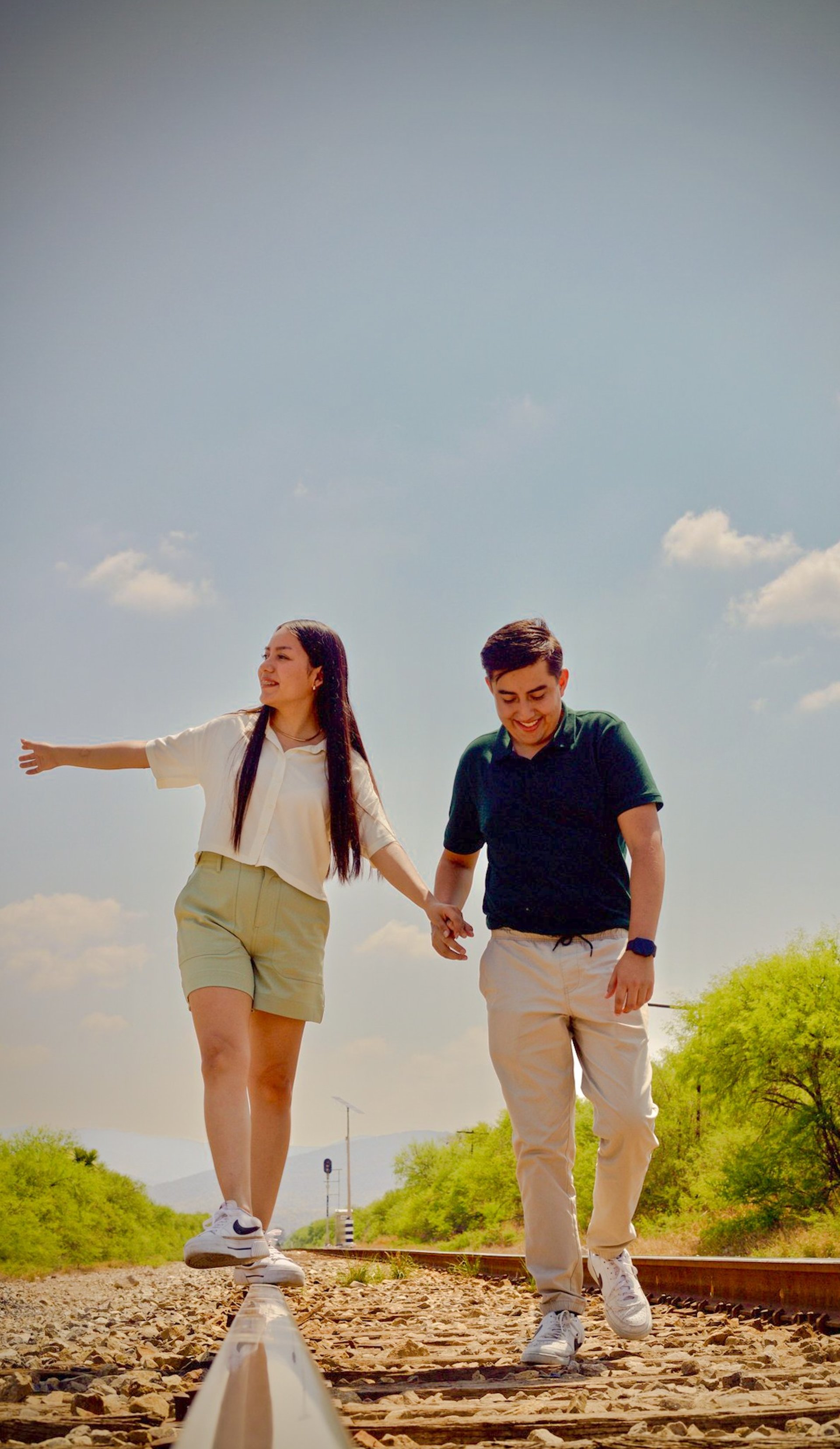 couple wearing silver-colored rings