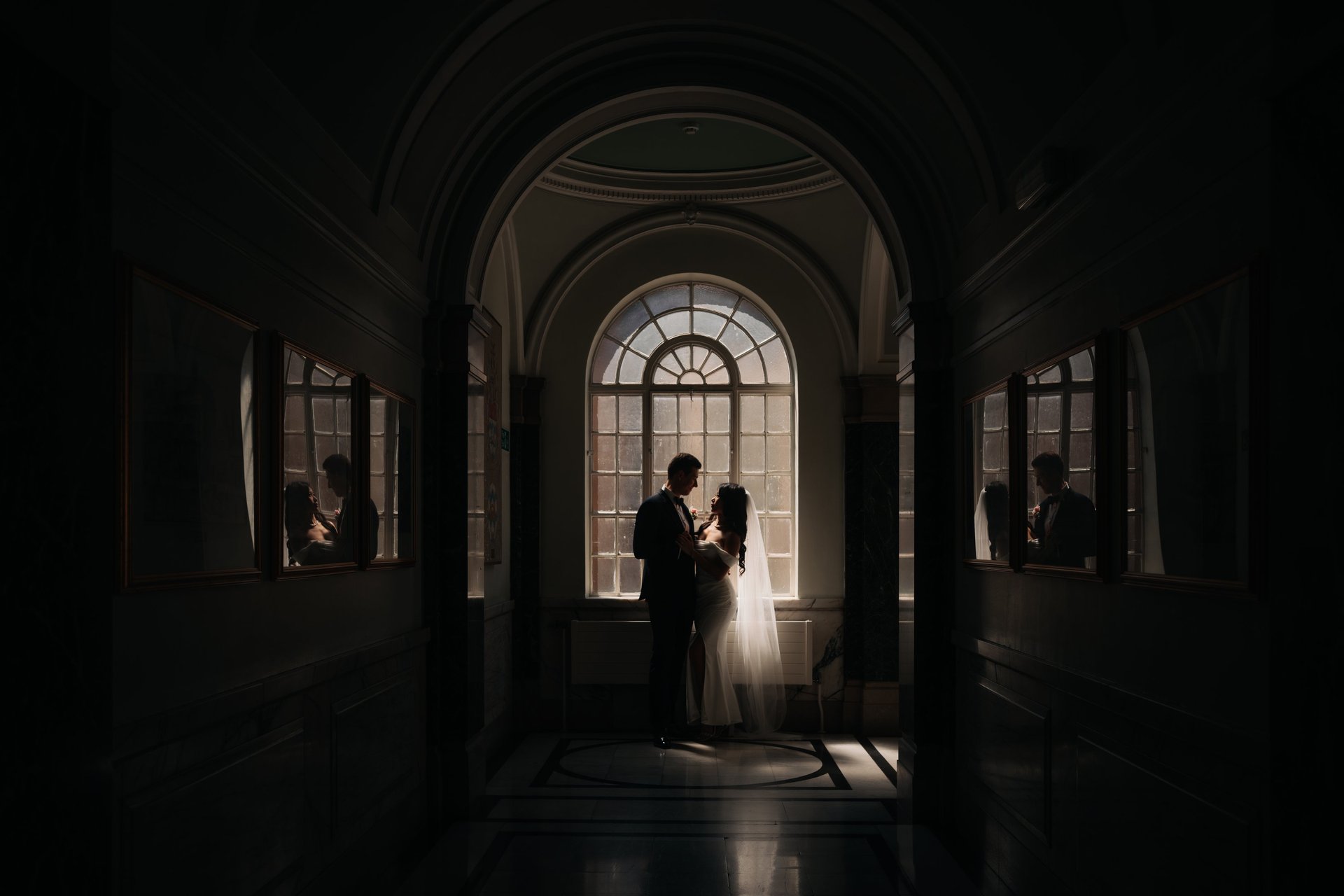 an abstract photo of a curved building with a blue sky in the background