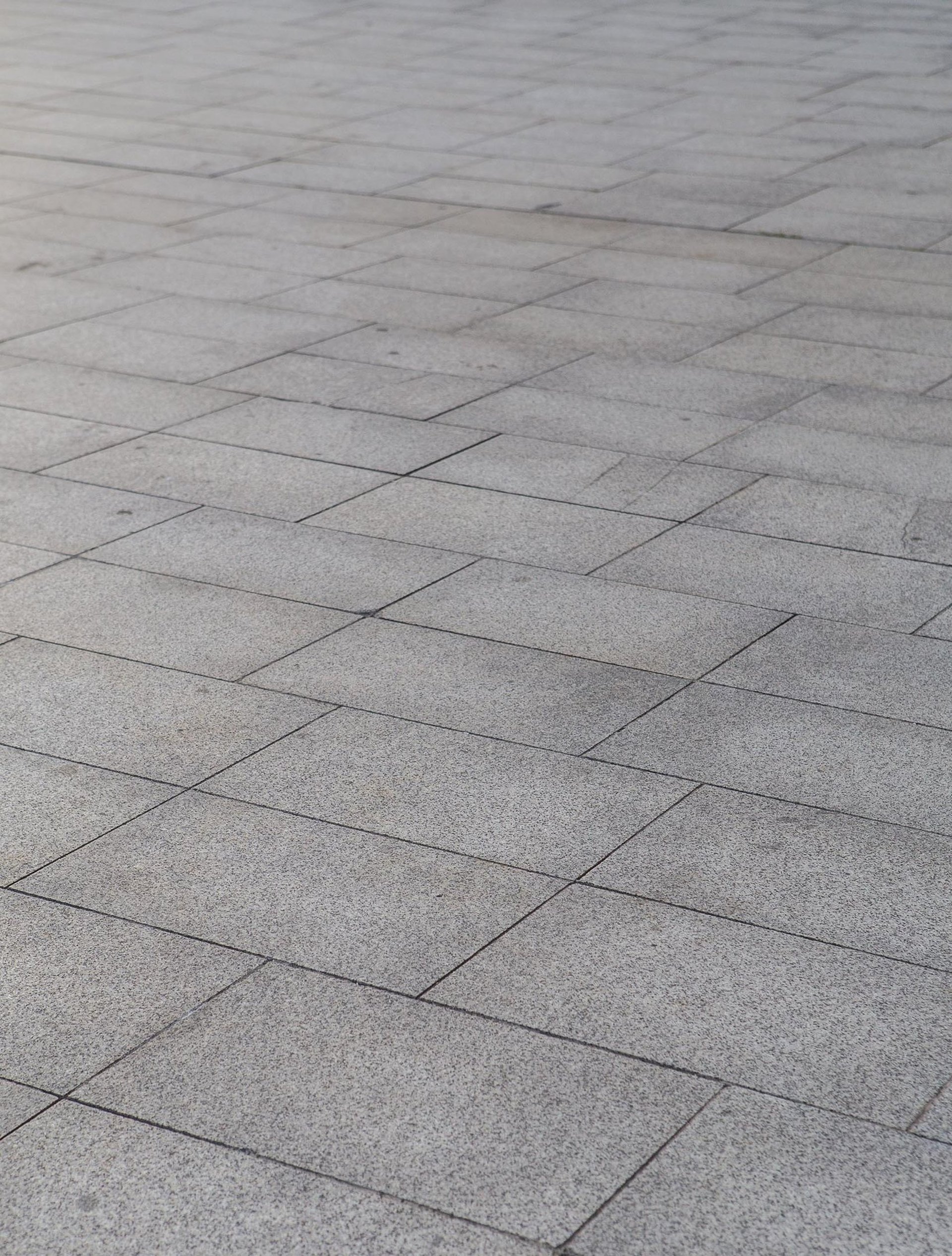 an abstract photo of a curved building with a blue sky in the background