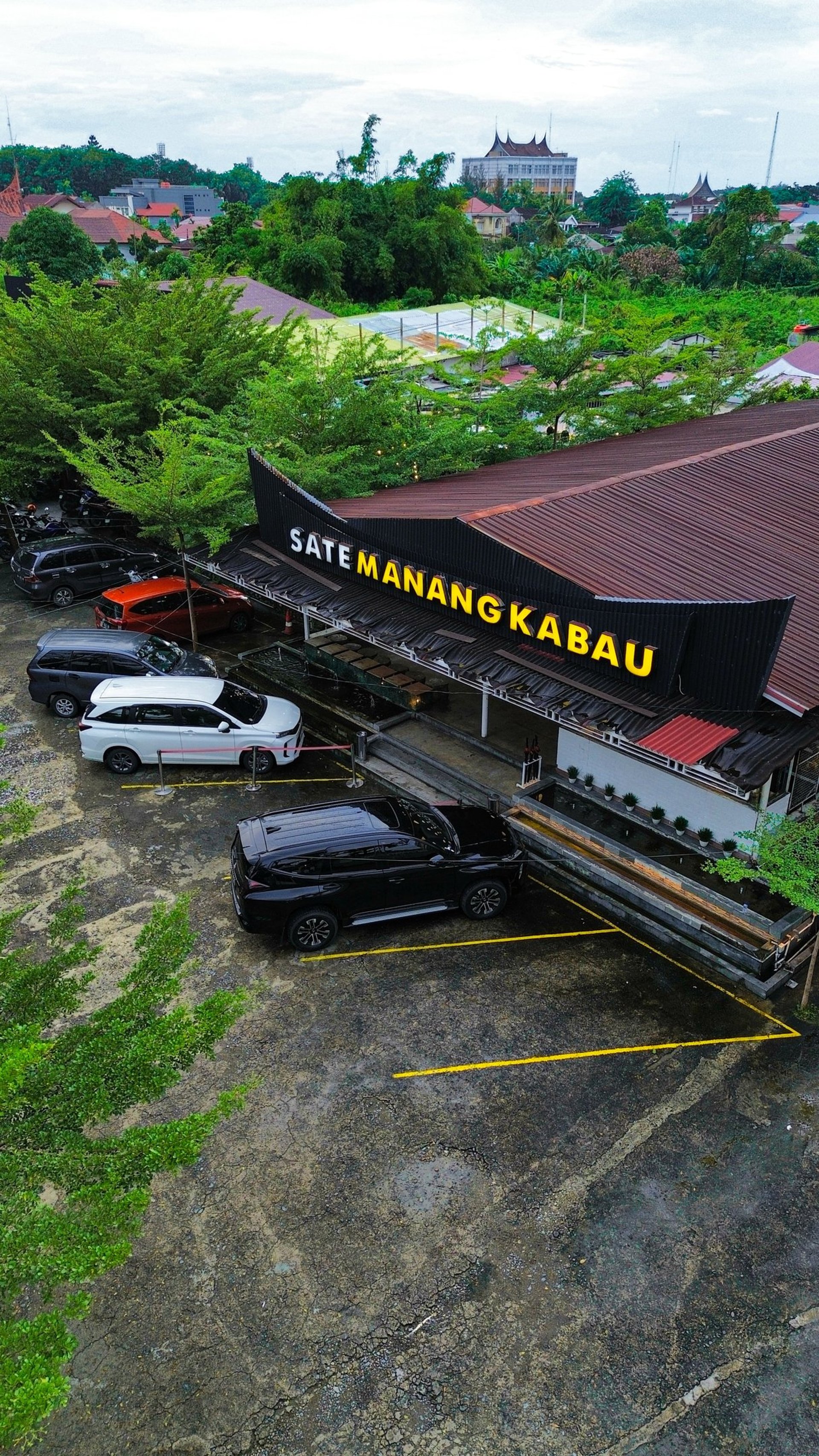 an abstract photo of a curved building with a blue sky in the background