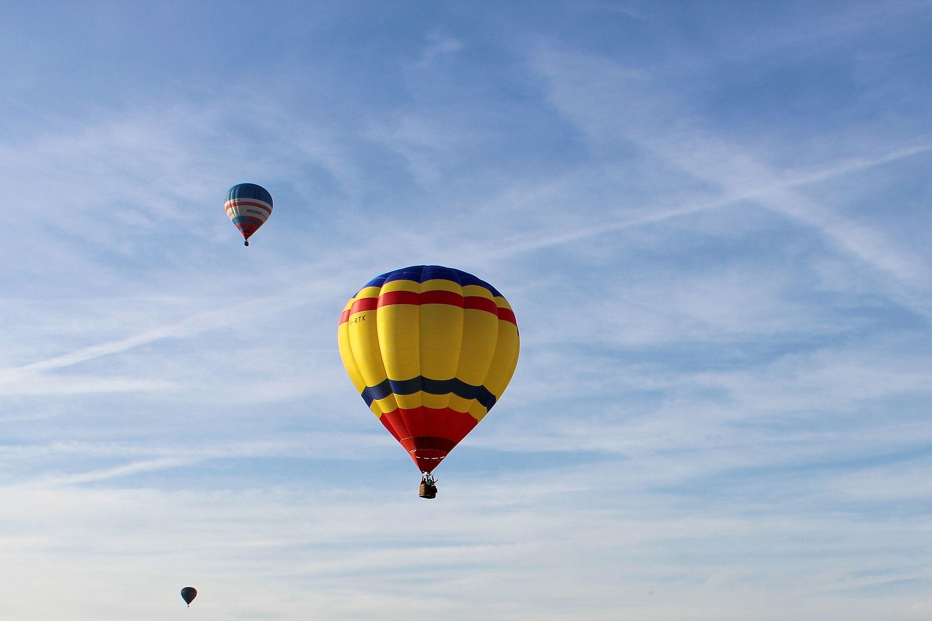 white and blue hot air balloon on sky