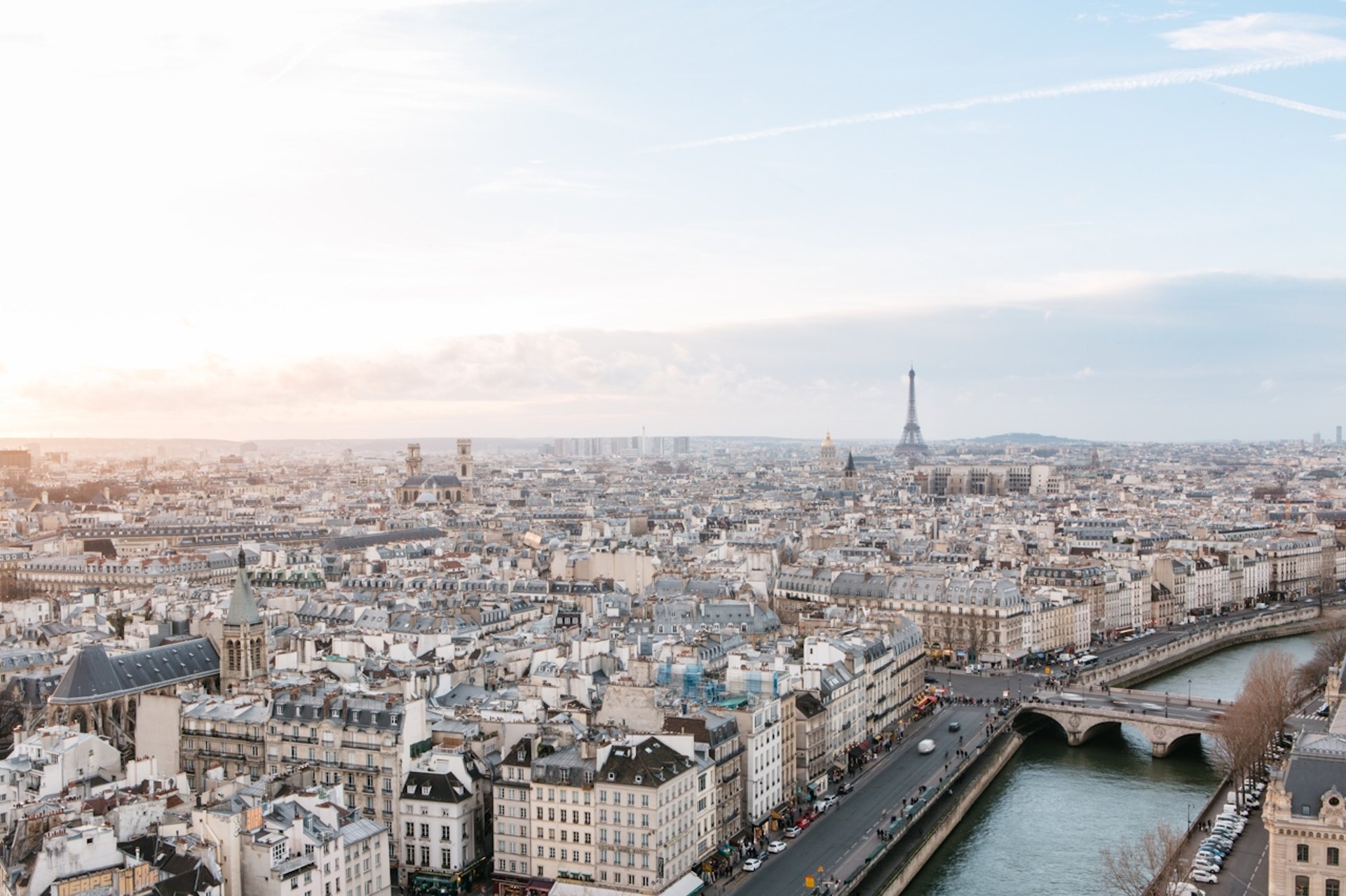 woman wearing yellow long-sleeved dress under white clouds and blue sky during daytime