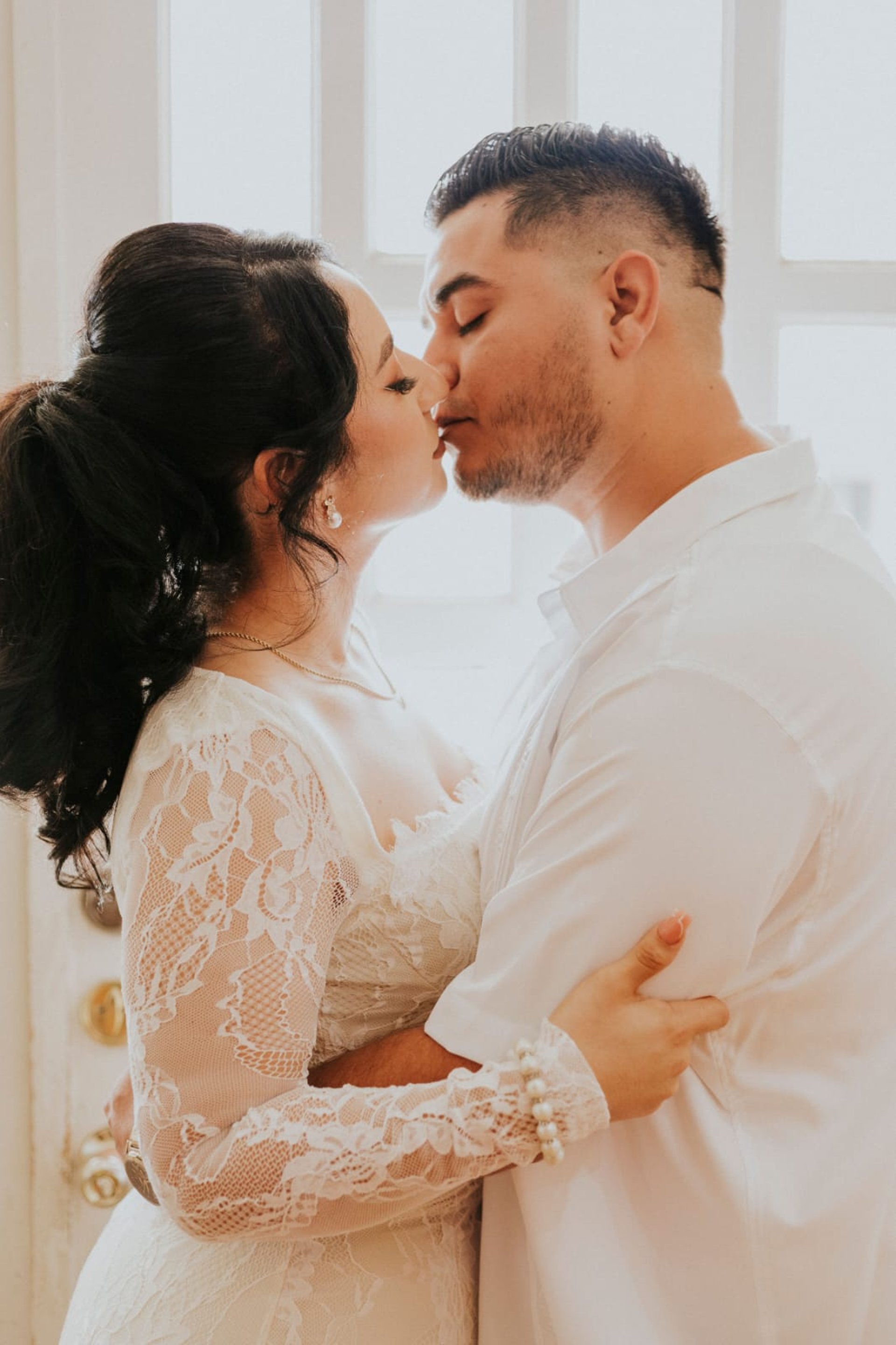couple wearing silver-colored rings