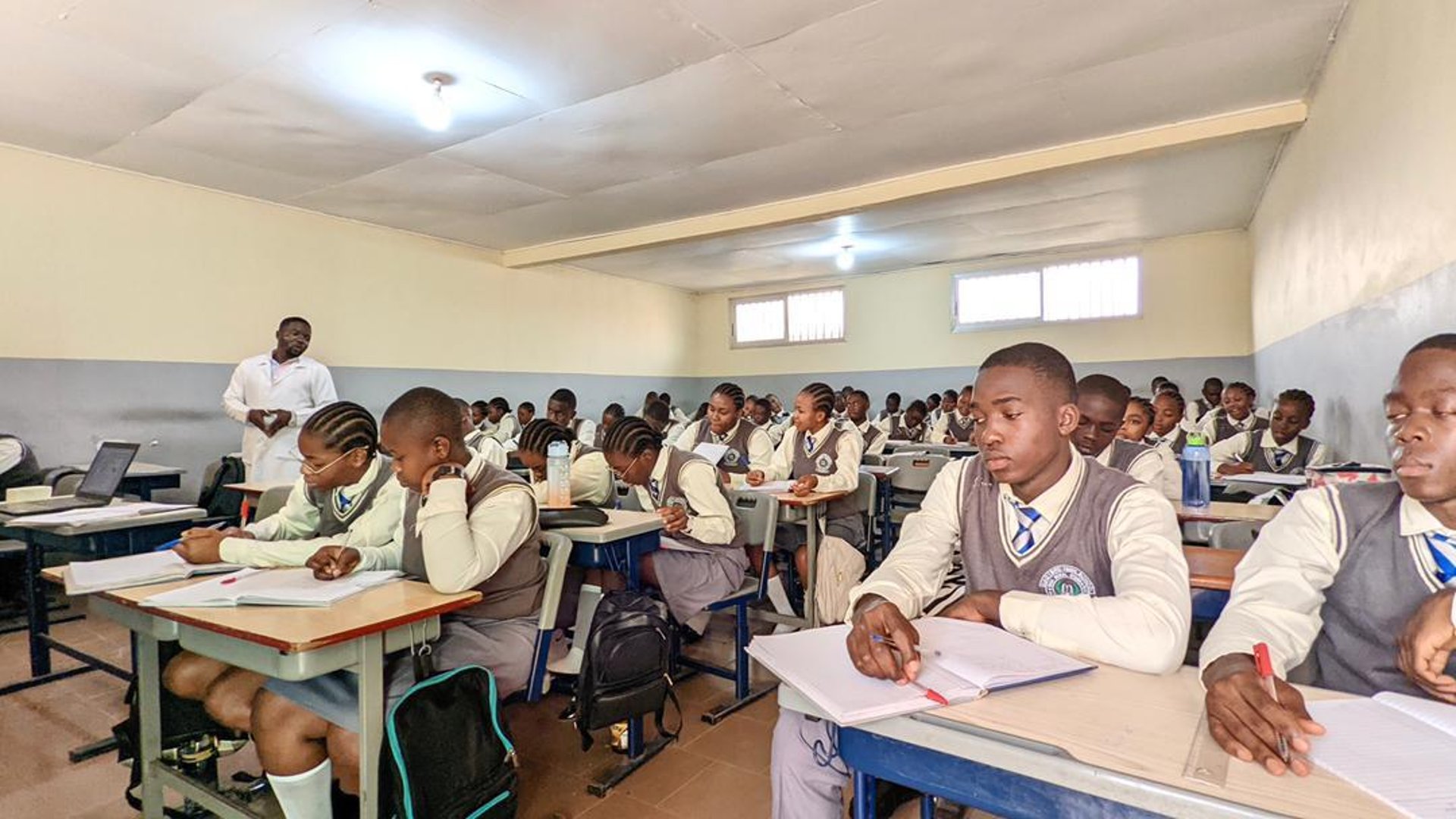 woman wearing yellow long-sleeved dress under white clouds and blue sky during daytime