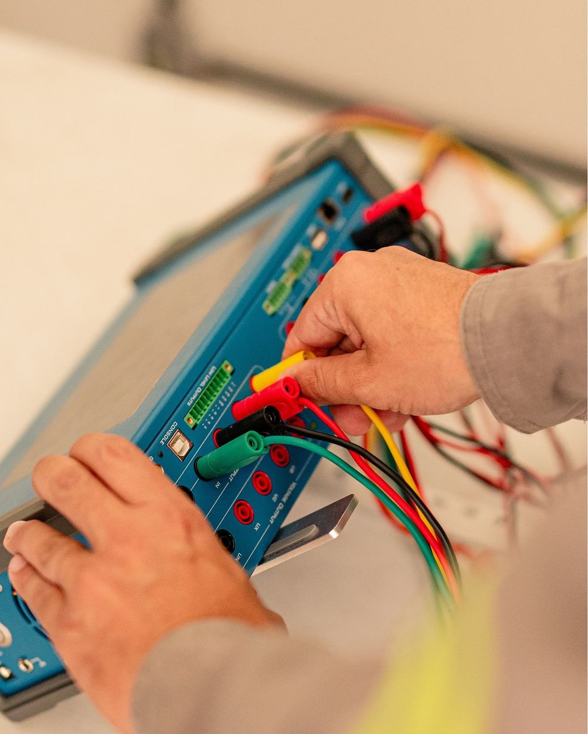 an abstract photo of a curved building with a blue sky in the background