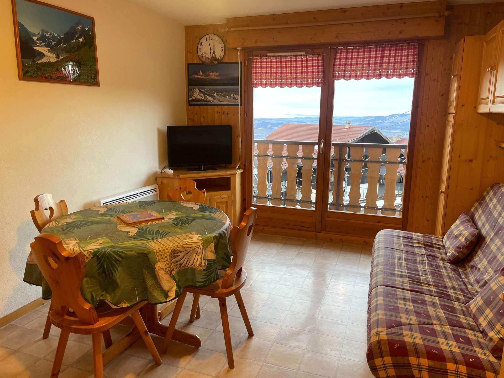 brown wooden house with green grass field