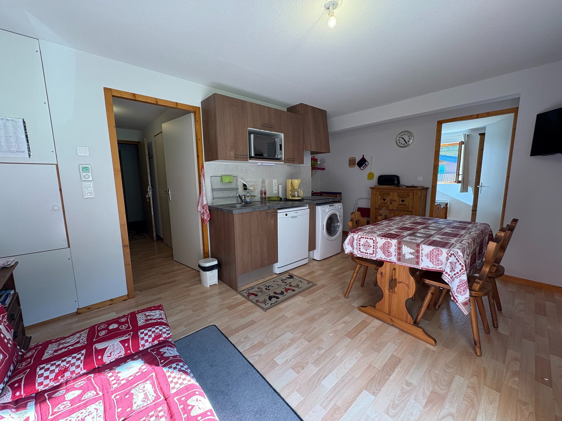 brown wooden house with green grass field