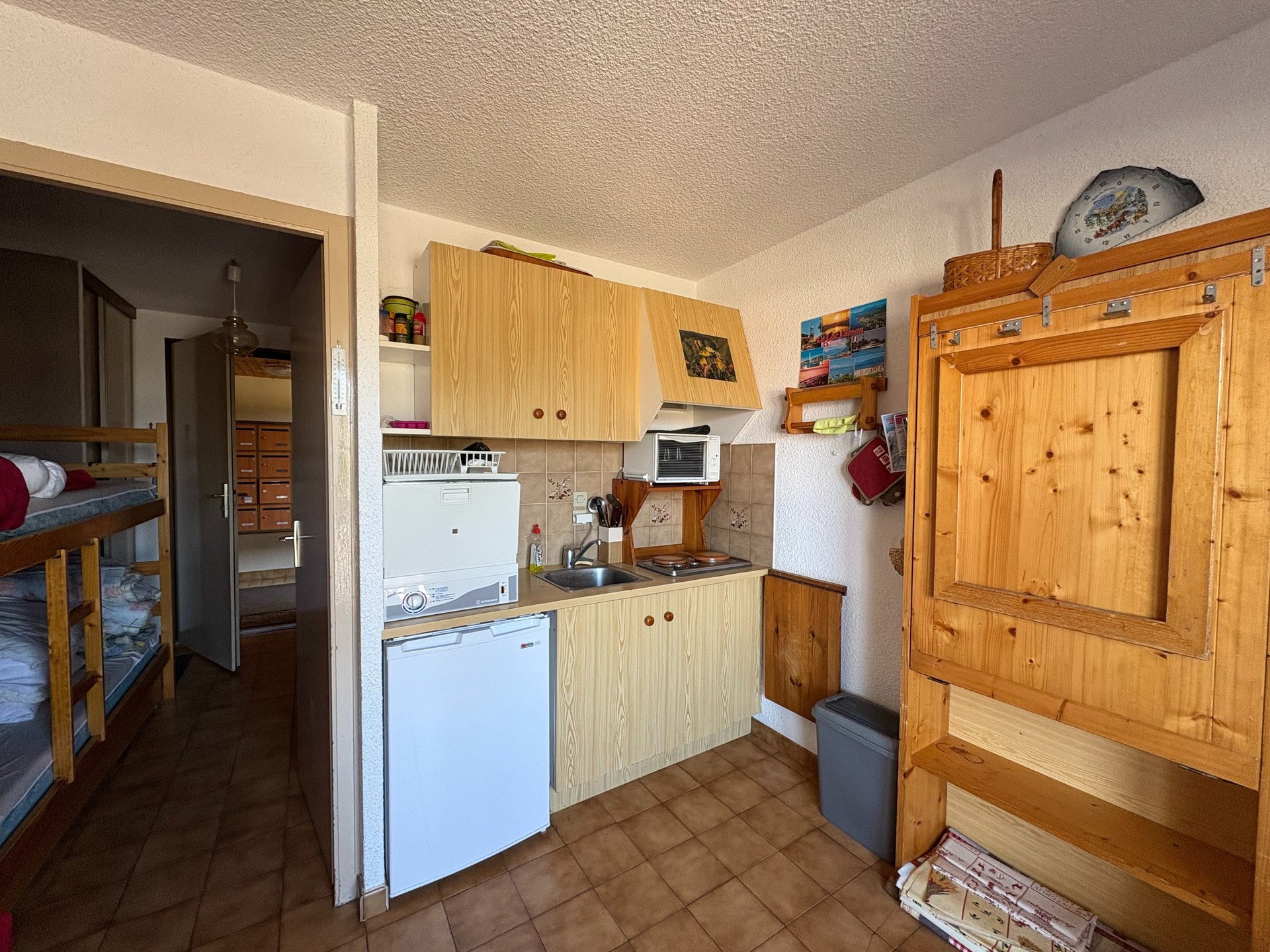 brown wooden house with green grass field