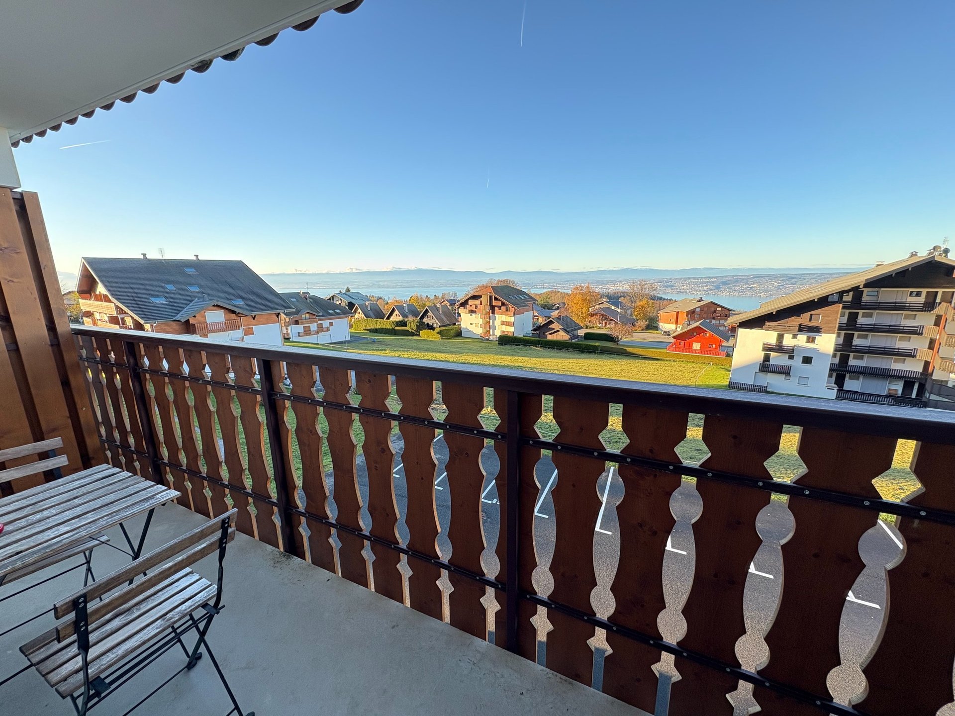 brown wooden house with green grass field