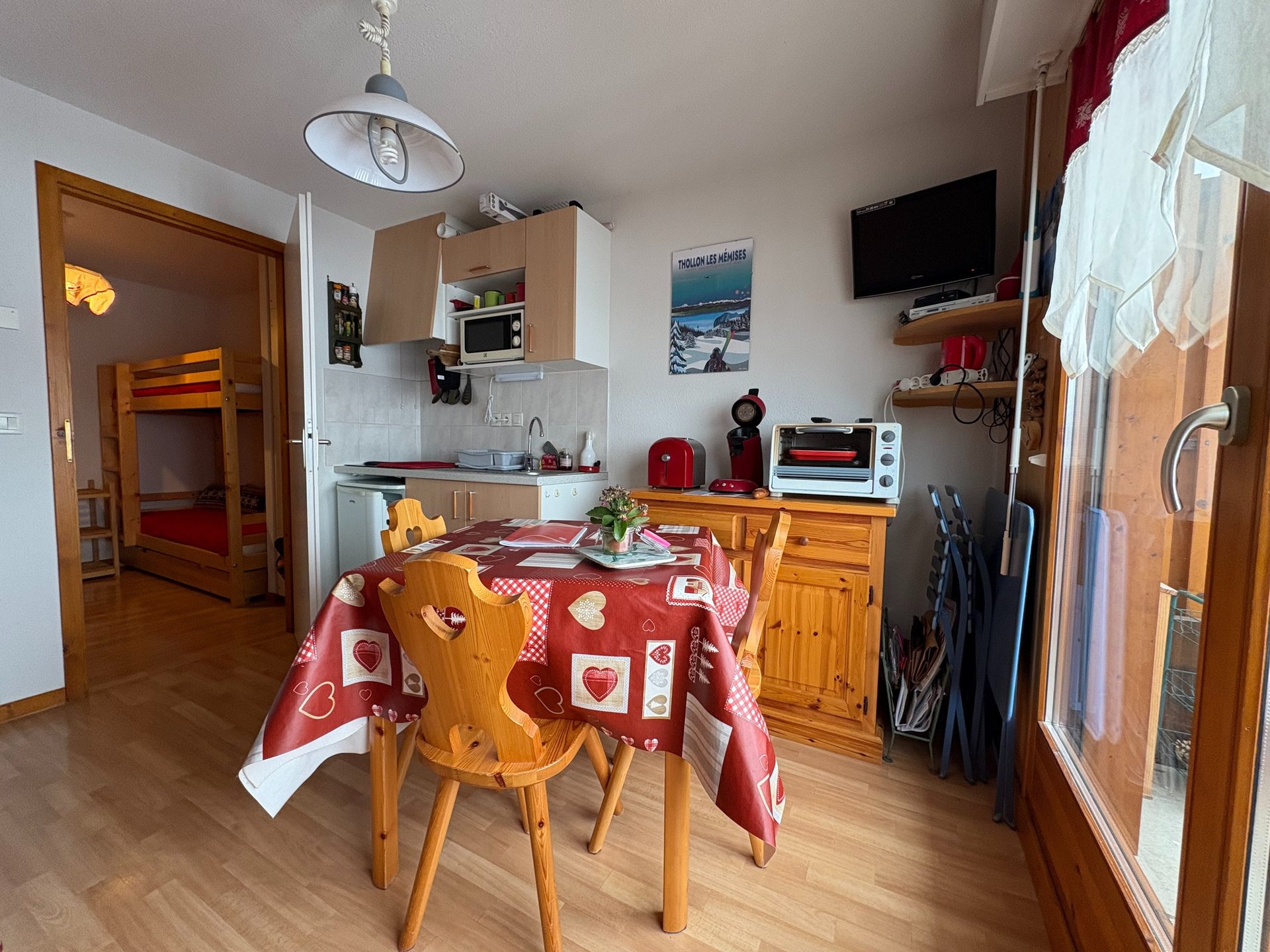 brown wooden house with green grass field