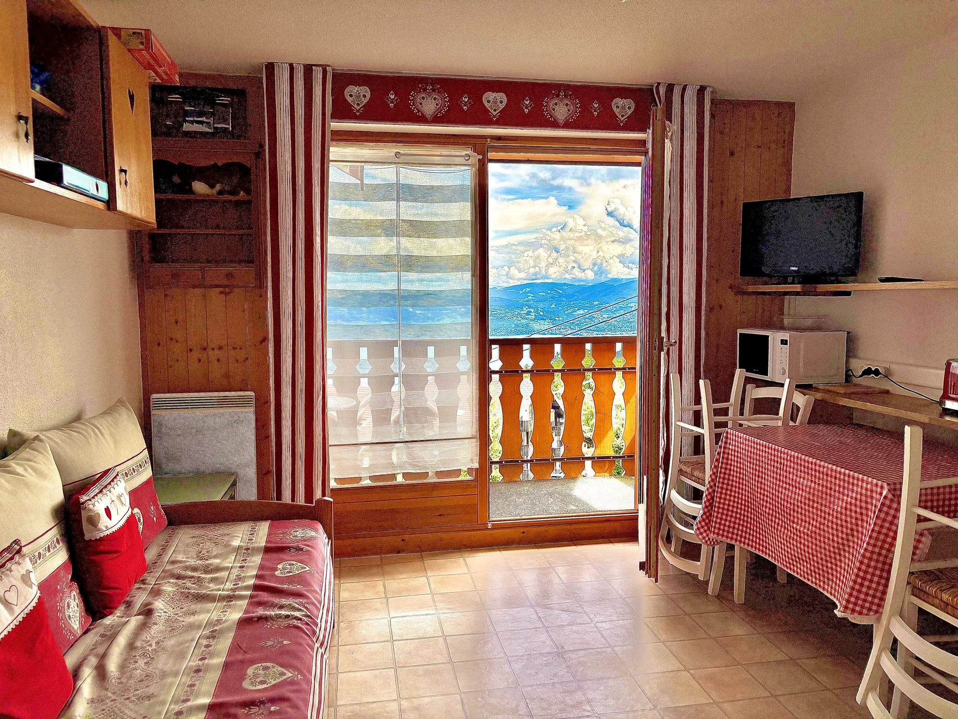 brown wooden house with green grass field