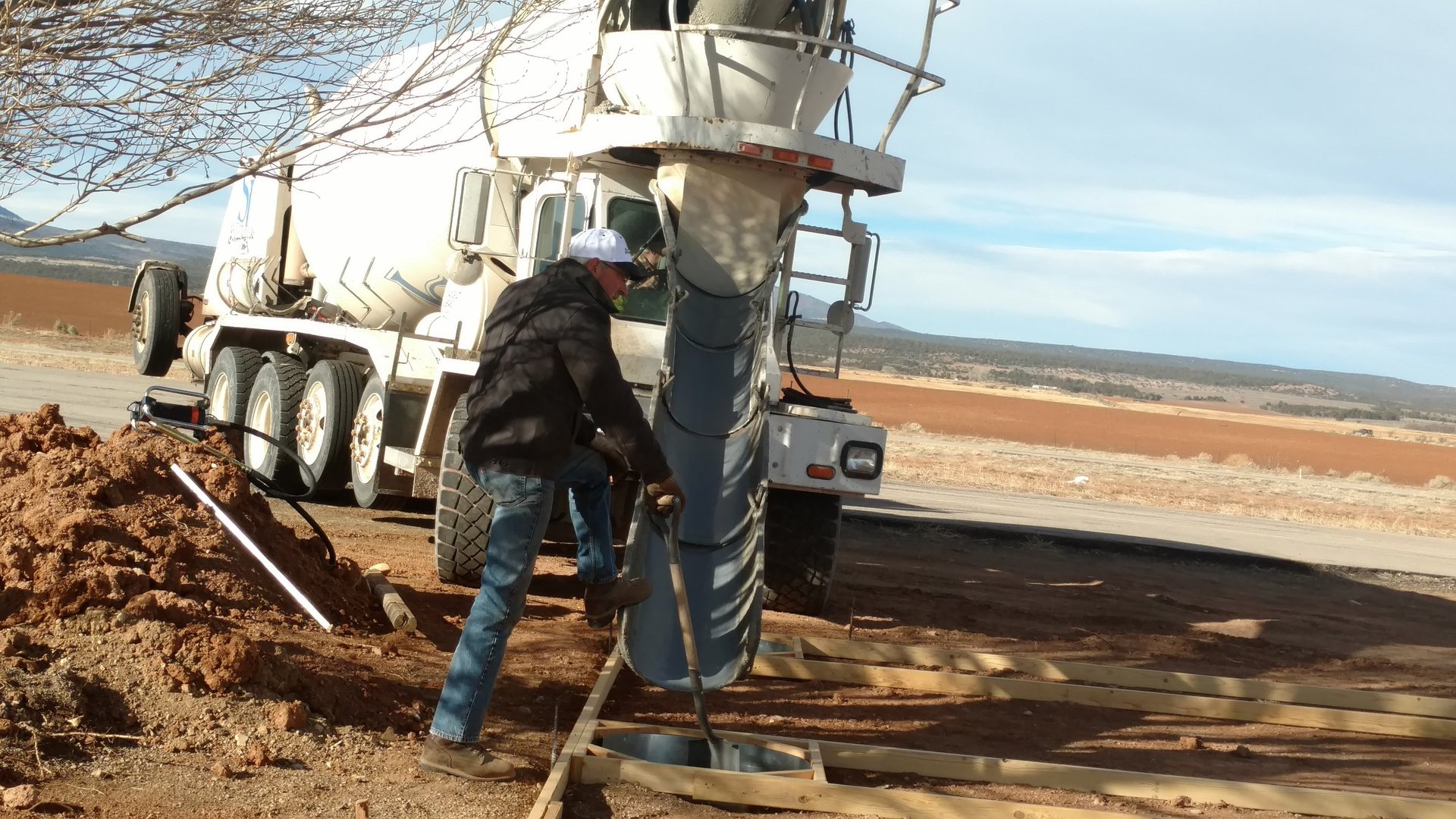 woman wearing yellow long-sleeved dress under white clouds and blue sky during daytime