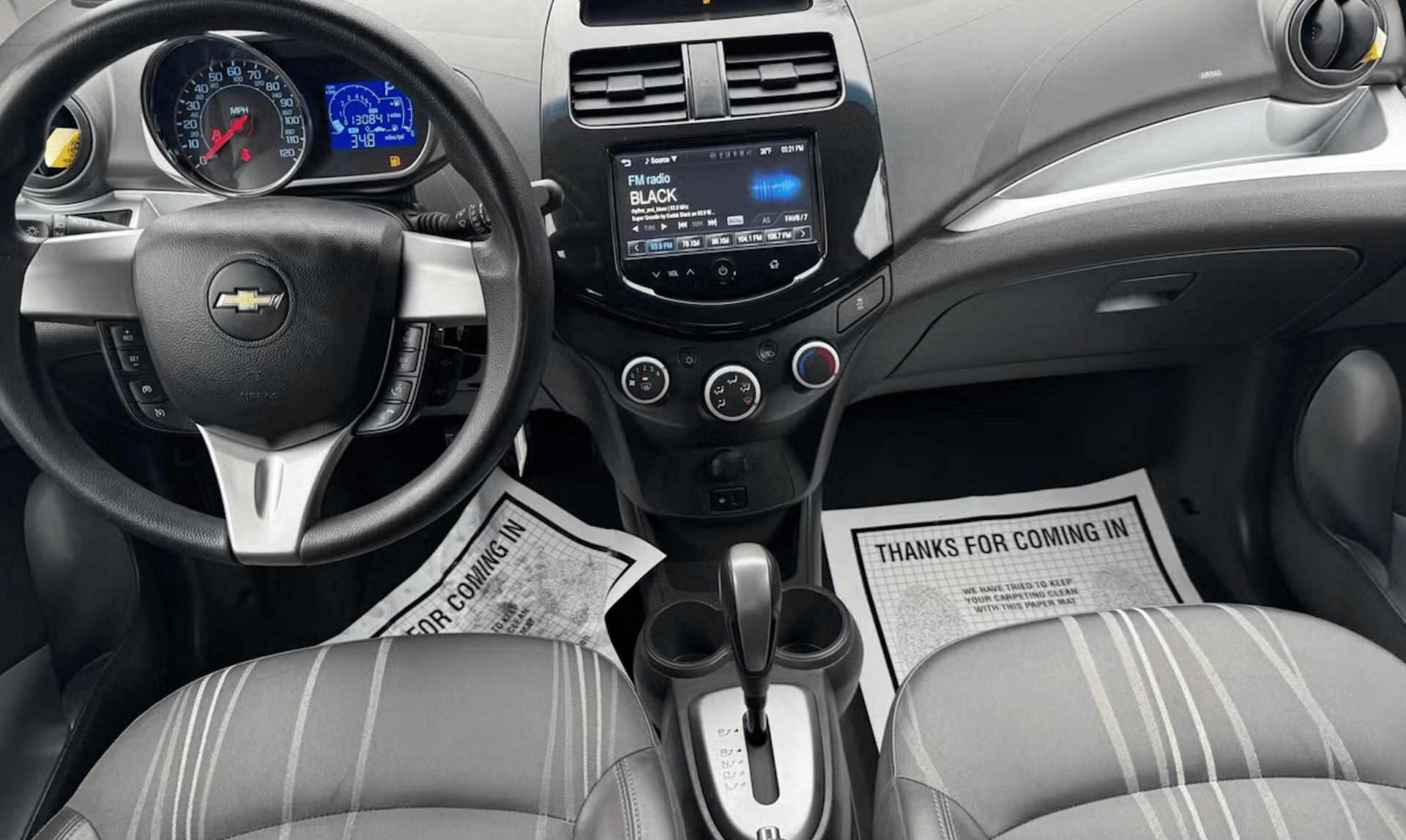the interior of a car with a steering wheel