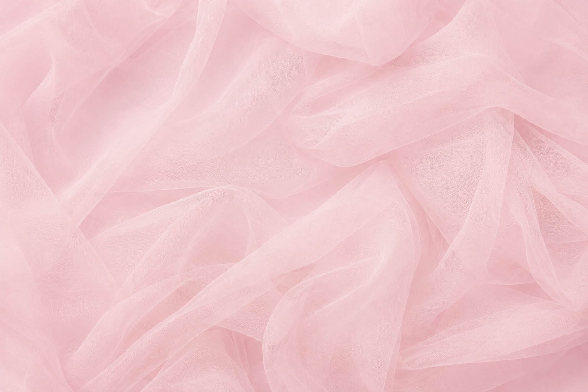 Smooth, rippling pink satin fabric texture
